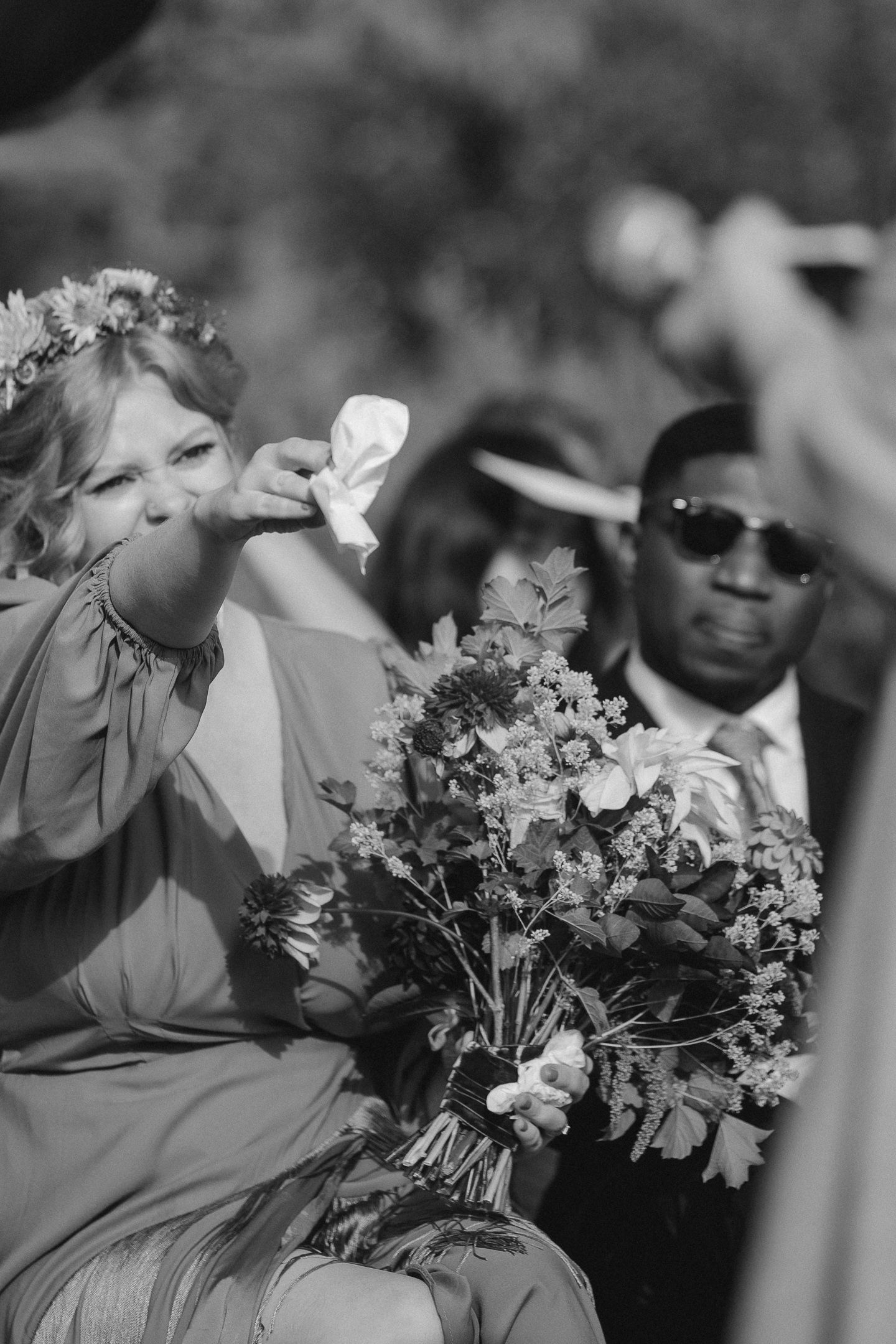 Black and white of guests at cocktail hour at a Harbor House Inn wedding in Mendocino, California, by Sammy Aucella Photography