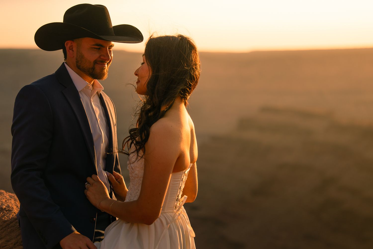 Cowboy groom and bride on the prairie at golden hour, by Sammy Aucella Photography