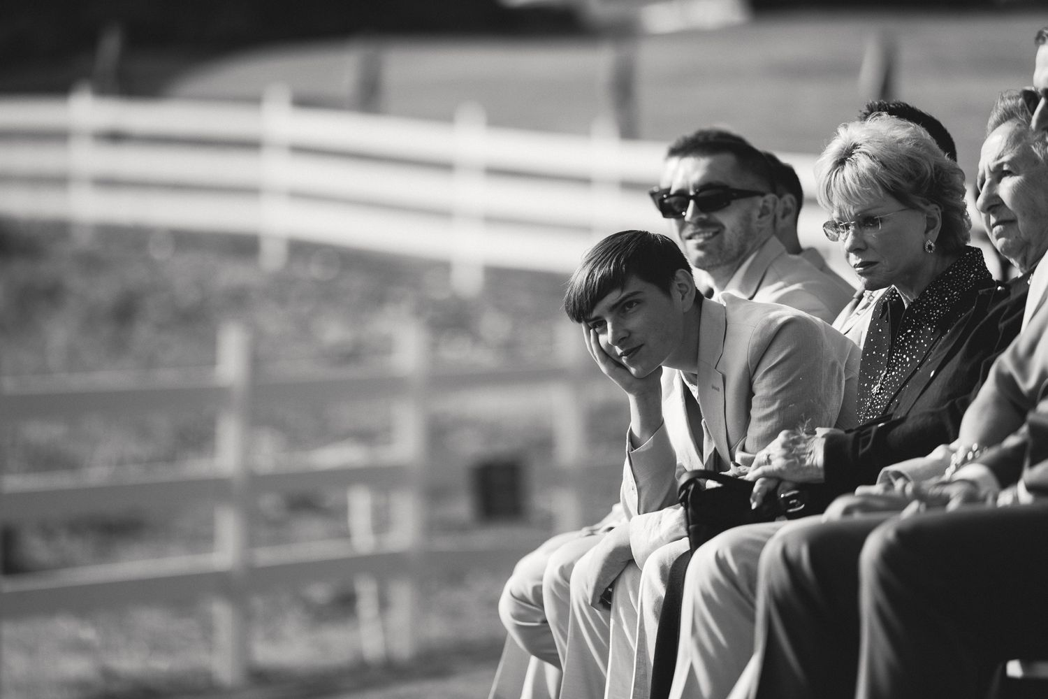 Guests watching an emotional outdoor ceremony at a Mission Ranch wedding in Carmel, California, by Sammy Aucella Photography