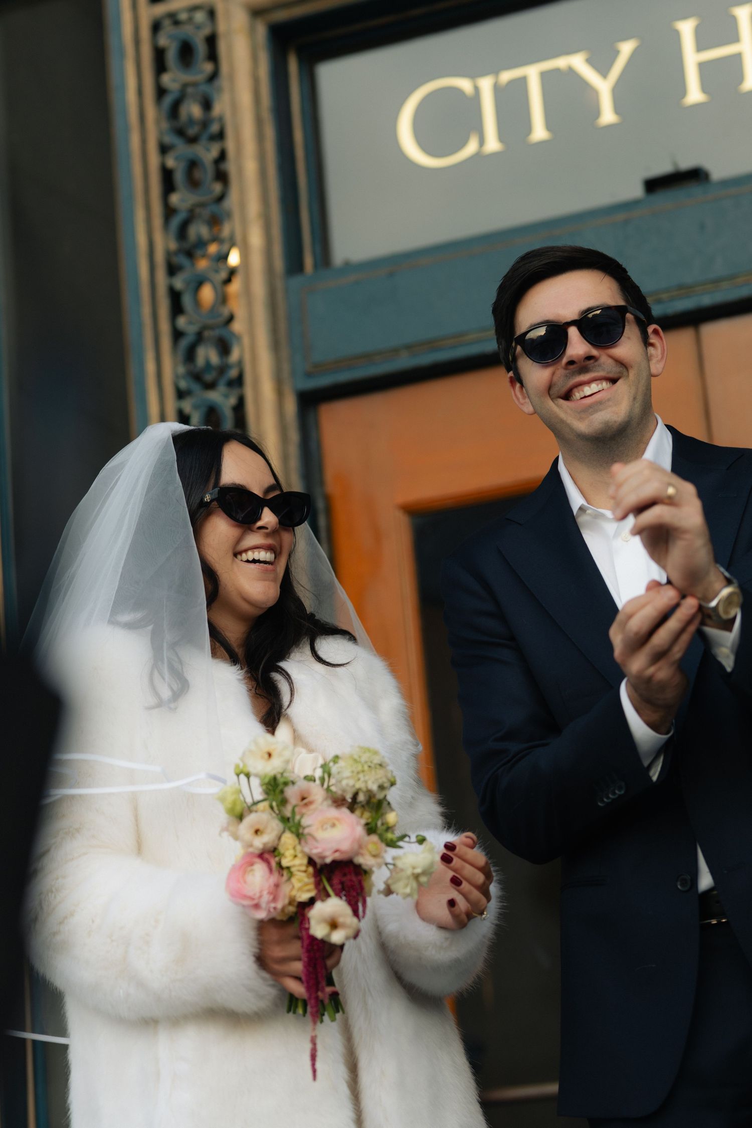Fun and candid elevator photo at San Francisco City Hall in San Francisco, CA by Sammy Aucella Photography.