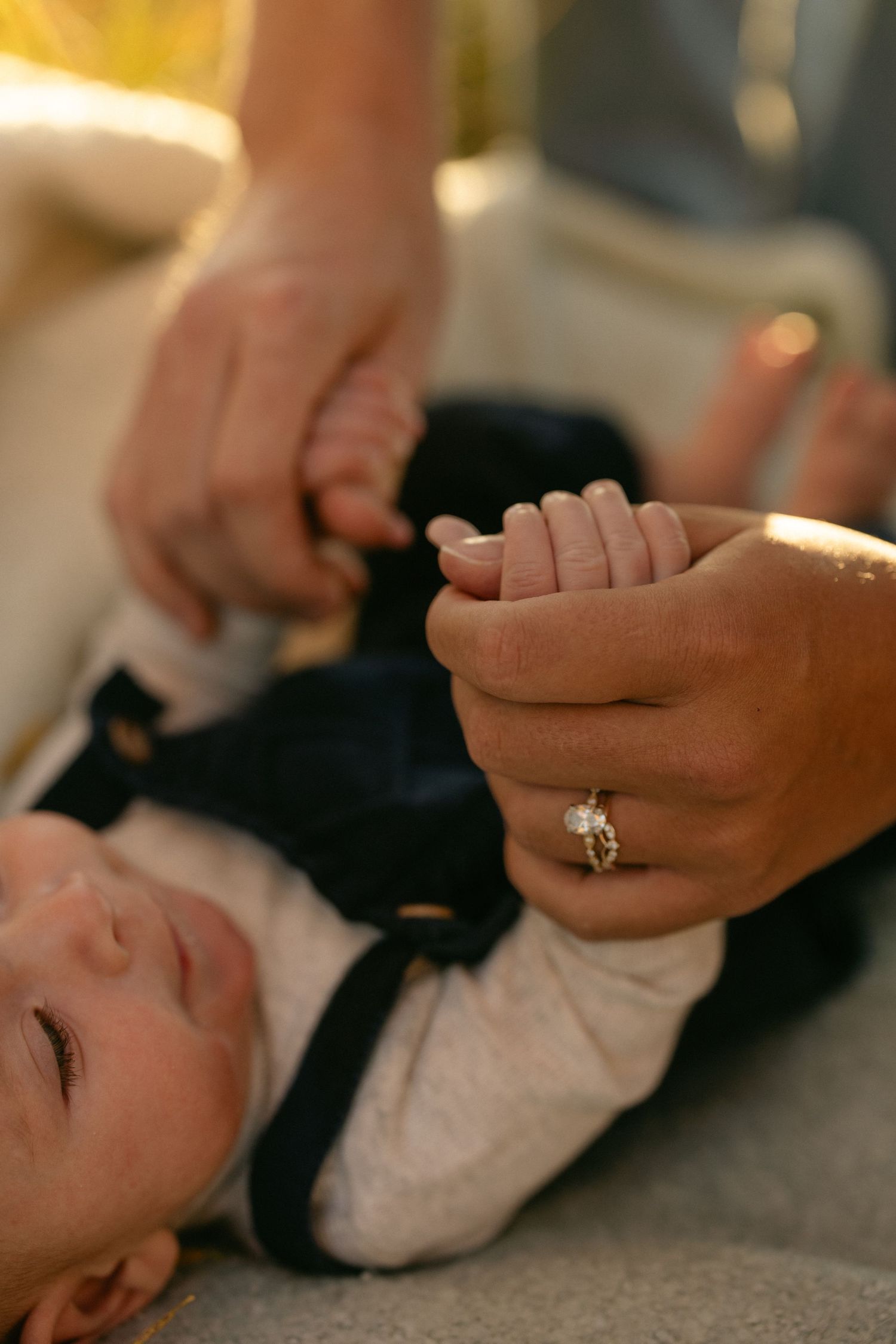 Close-up of a couple exchanging rings during their ceremony, tender wedding detail photography