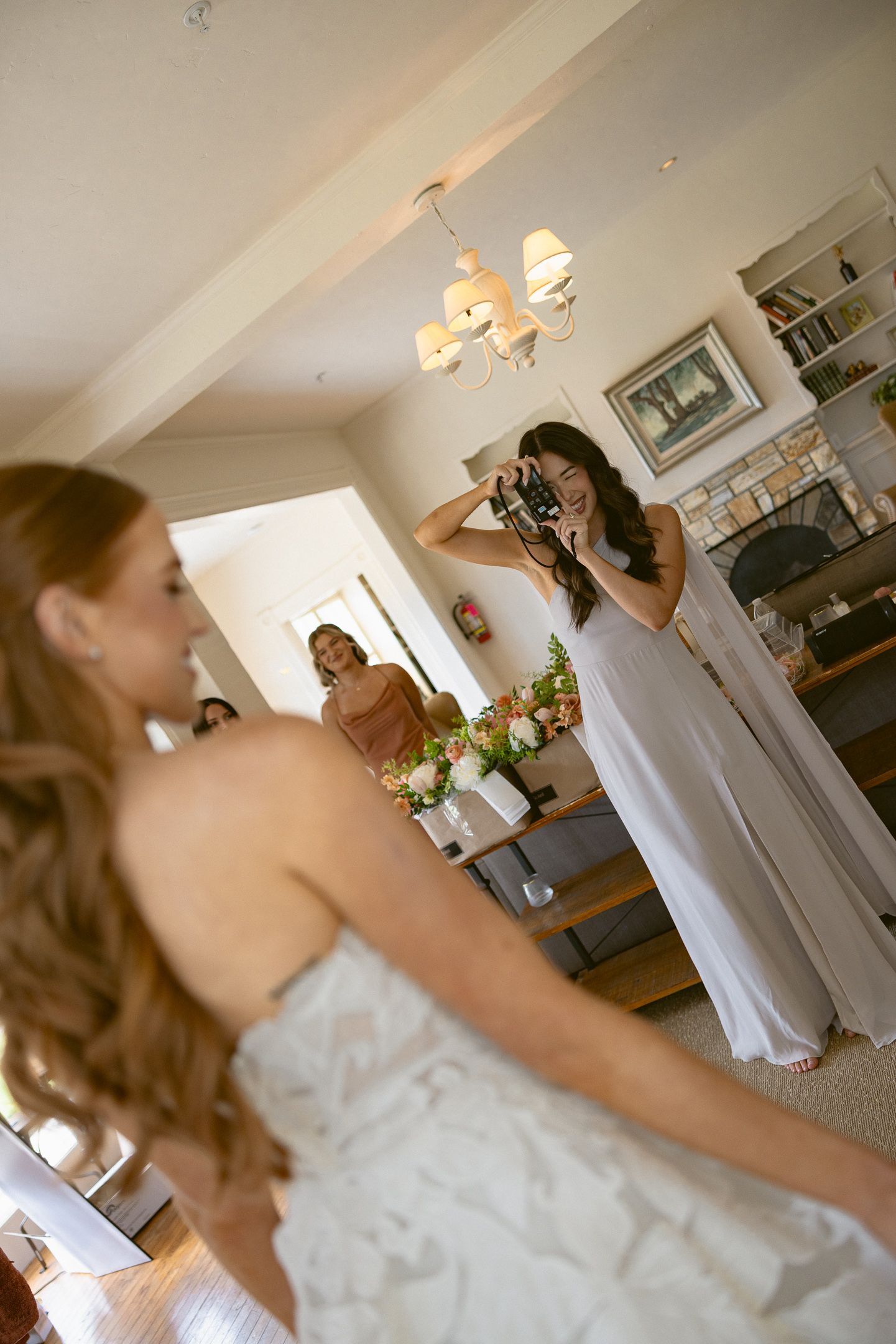 Bride getting ready as her photographer captures the moment at a Mission Ranch wedding in Carmel, CA, by Sammy Aucella Photography