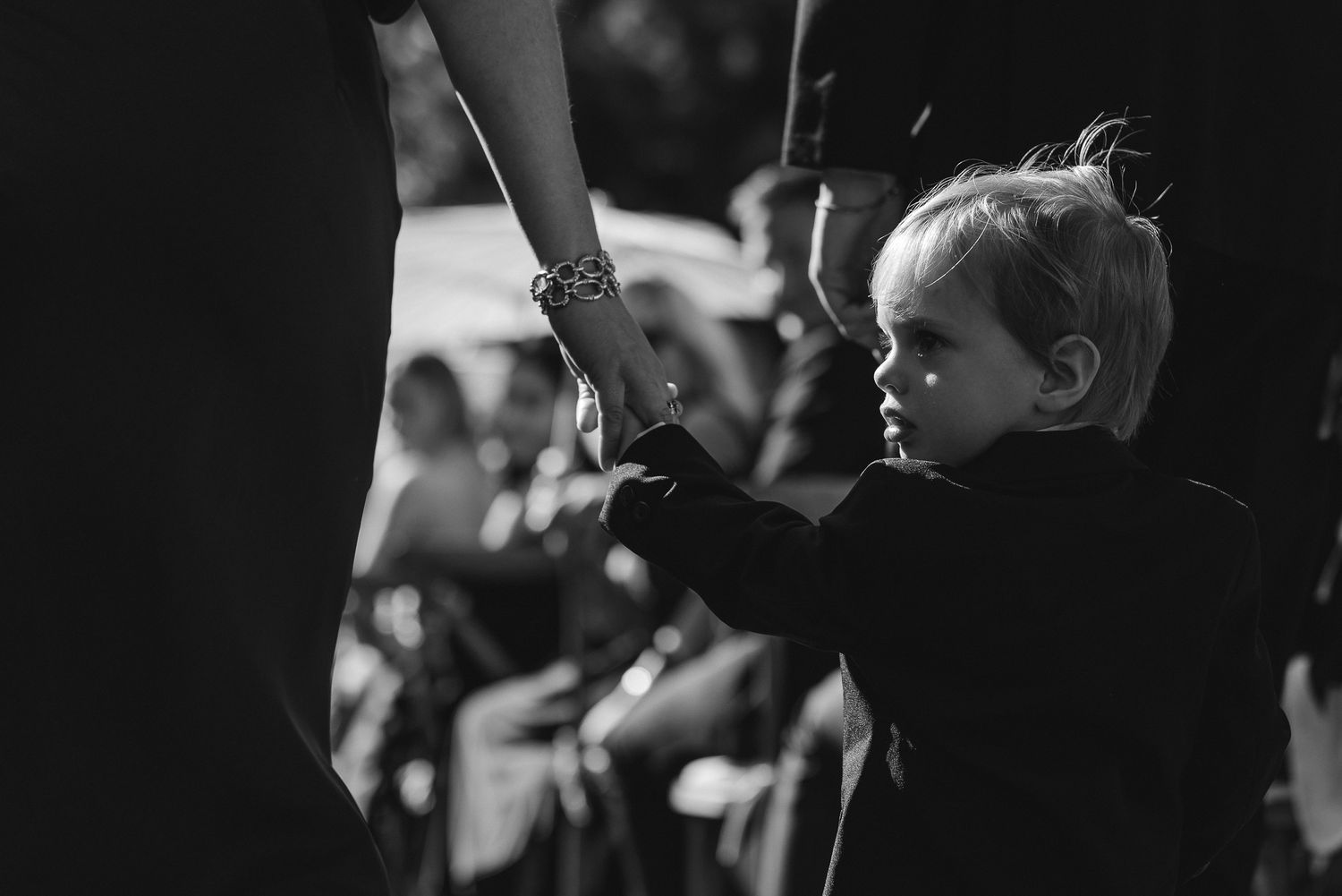 Artful black and white of a child during a Glenbrook ceremony on Lake Tahoe, by Sammy Aucella Photography
