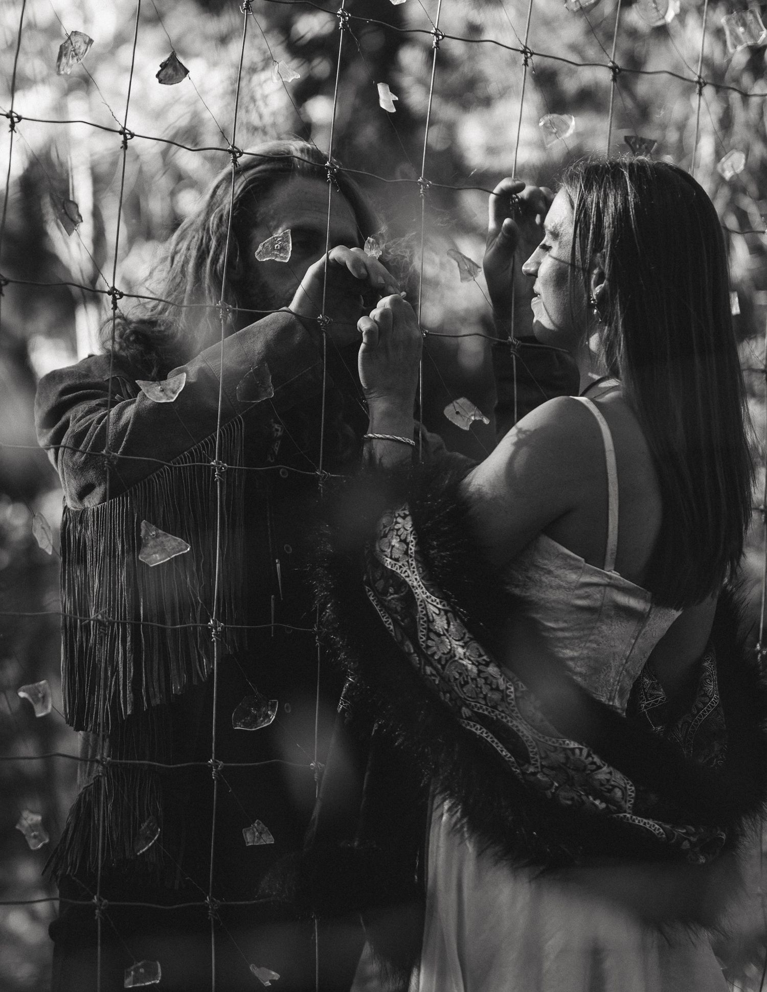 Black and white couple in dramatic low light at an adventure session, by Sammy Aucella Photography