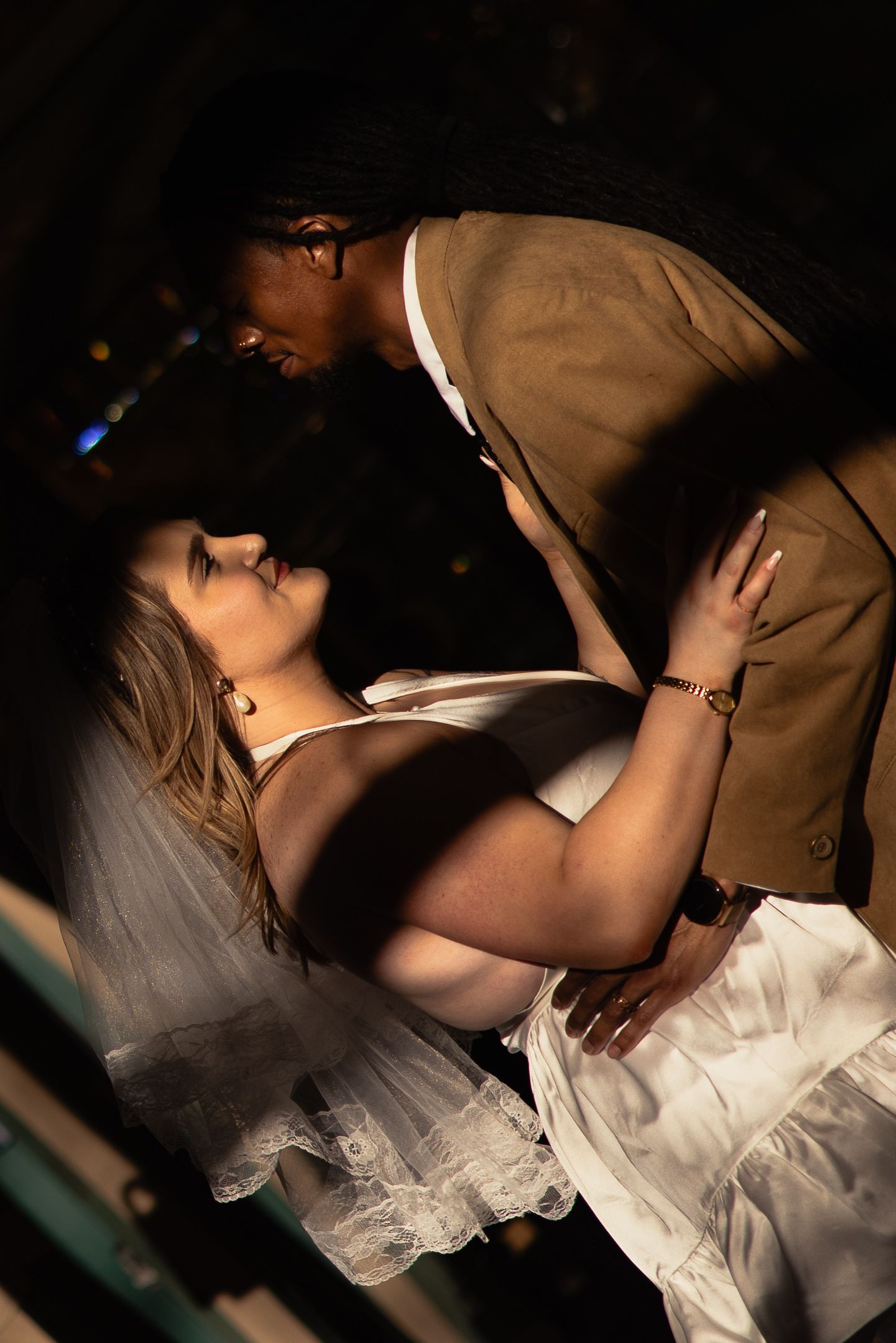 Black and white couple dancing closely at an adventure session, by Sammy Aucella Photography