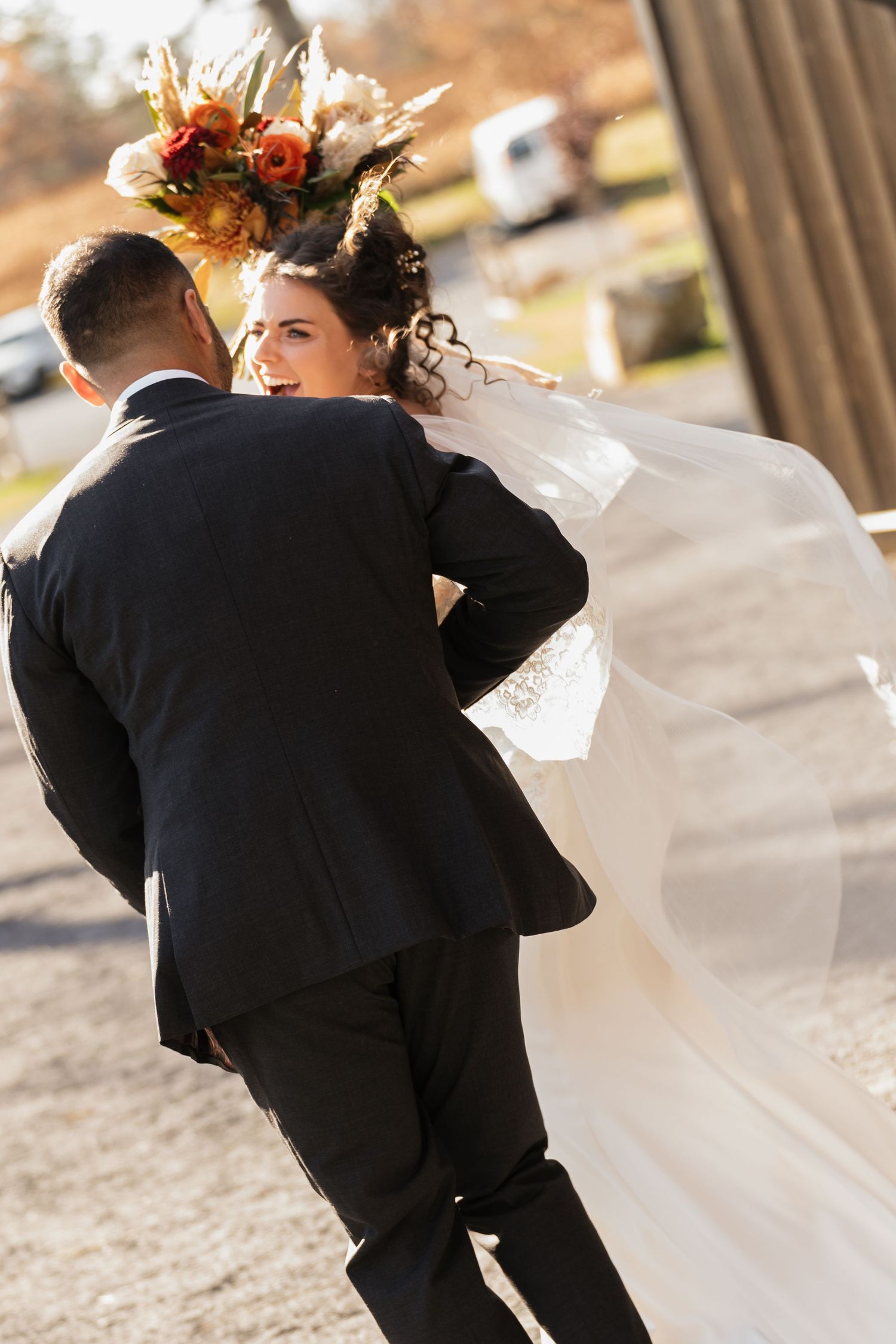Candid wedding moments captured in motion against architectural columns.