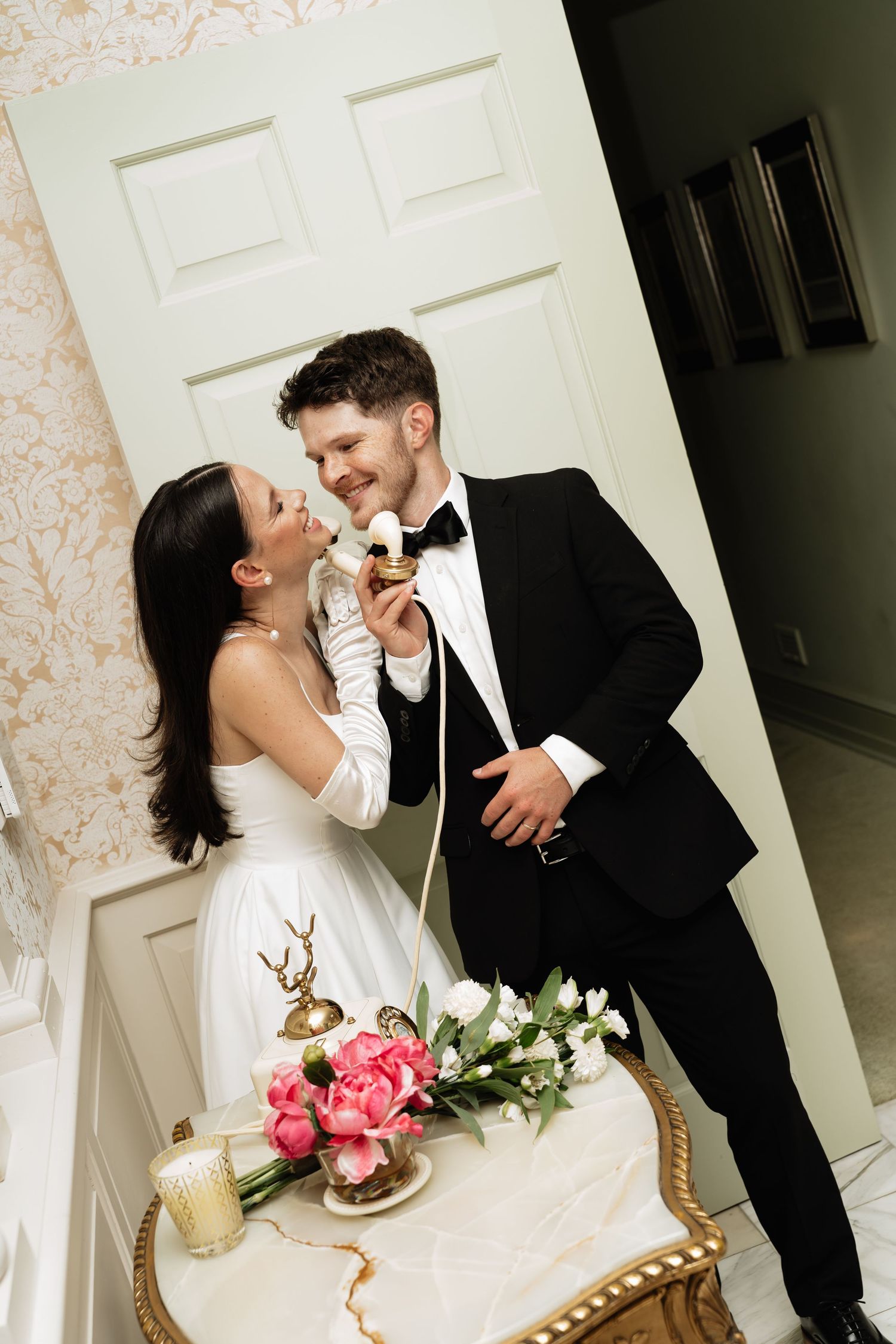 A romantic wedding cake cutting sequence shows a couple sharing sweet moments in front of a white door.