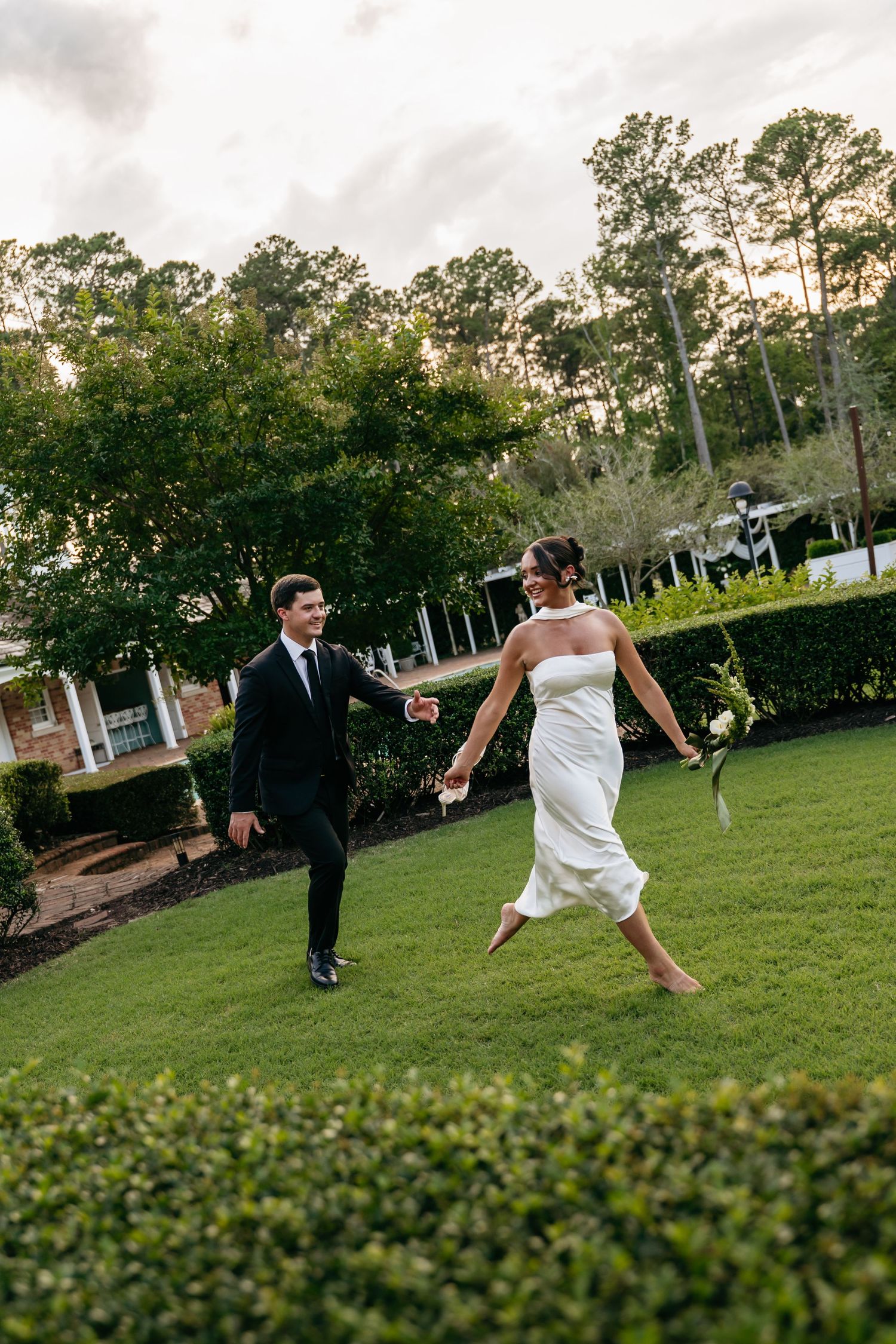 A sequence of photos showing a couple dancing playfully on a green lawn at sunset with trees in the background.