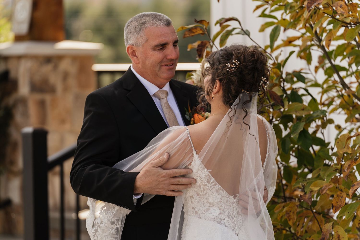 Wedding couple shares intimate moments during an autumn outdoor photo session.