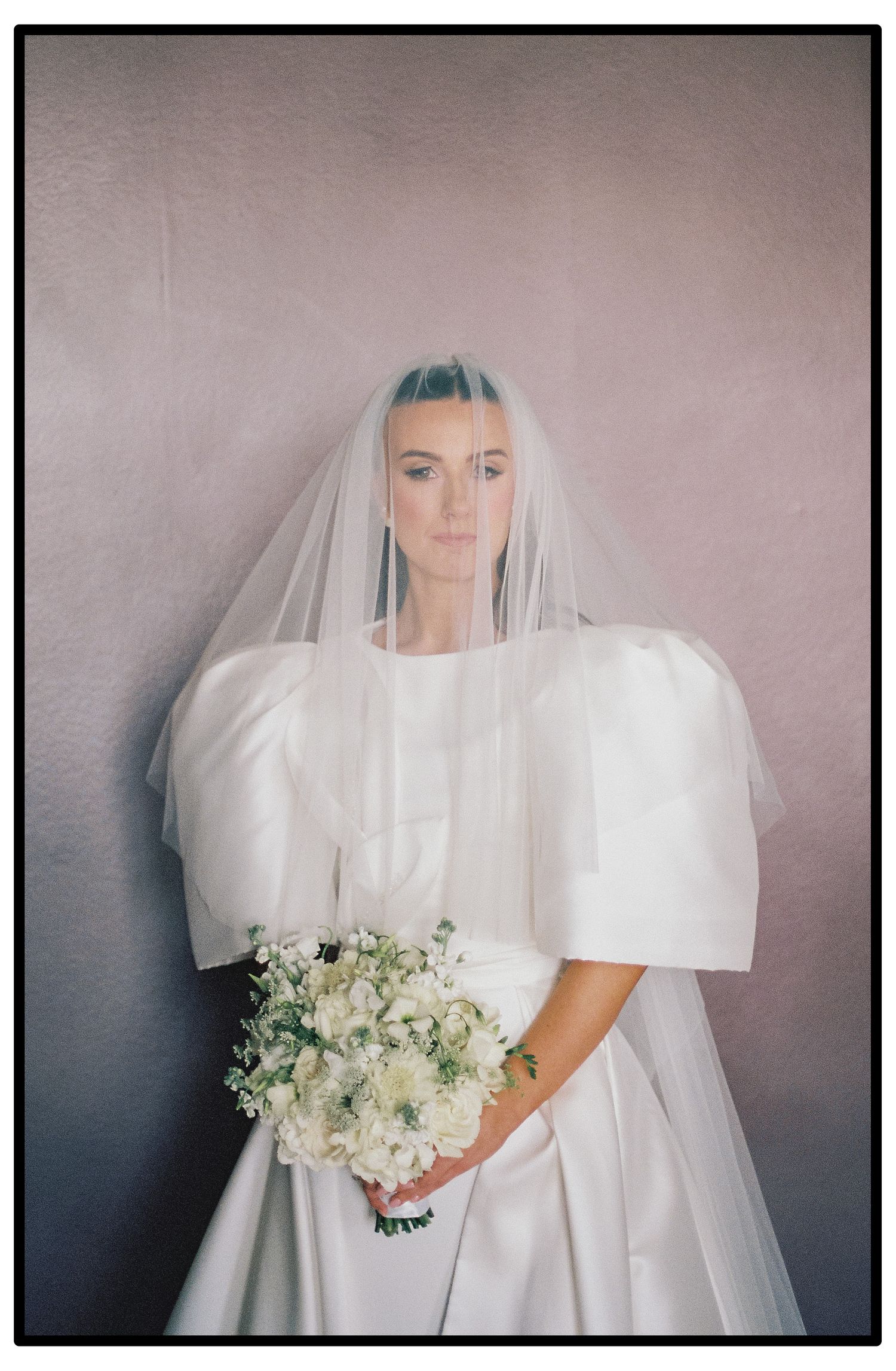 Artistic bridal portraits showing a veiled figure in white holding a delicate bouquet of flowers.