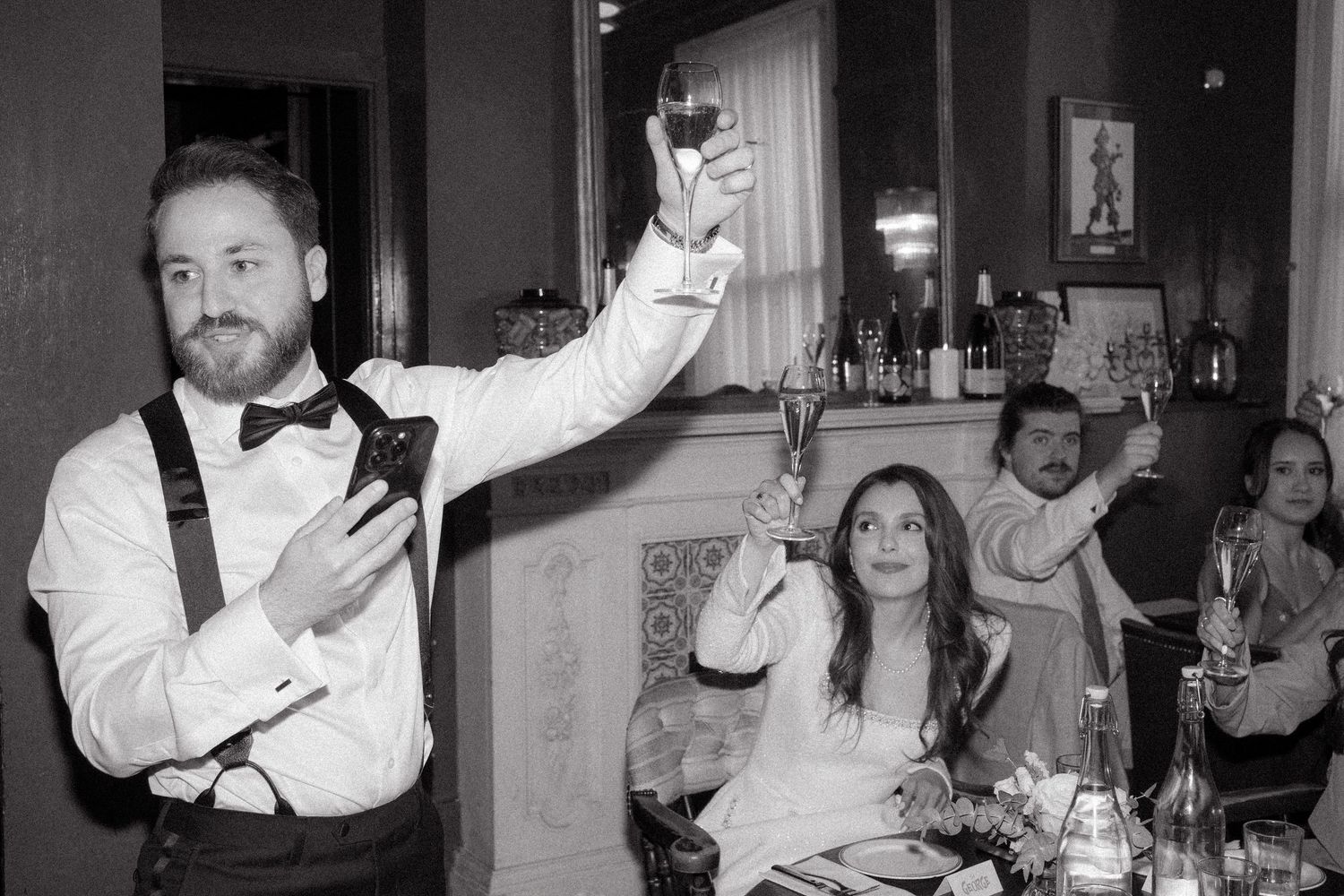 Black and white photos of wedding reception moments with guests and staff.