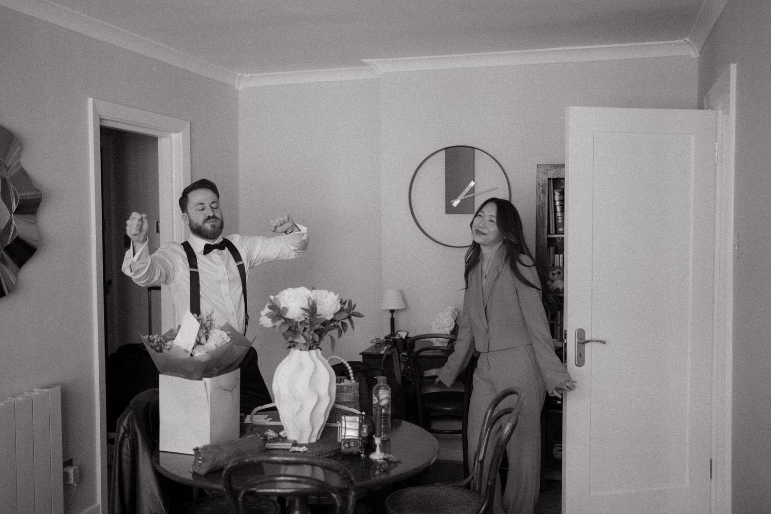 Black and white wedding preparation photos showing interior rooms and getting ready moments.