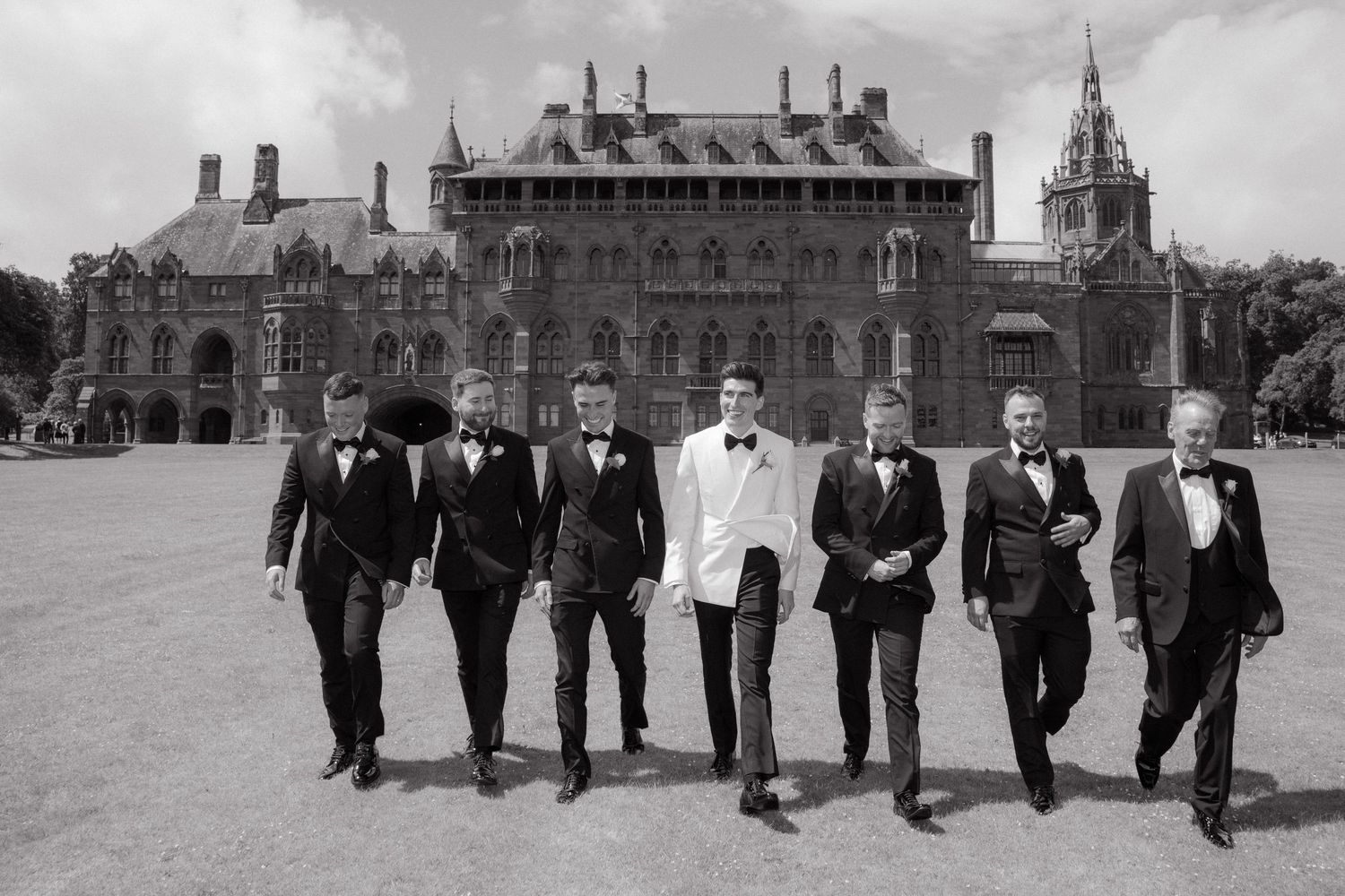 A series of black and white photographs showing a group walking in formal attire across a grand architectural setting.