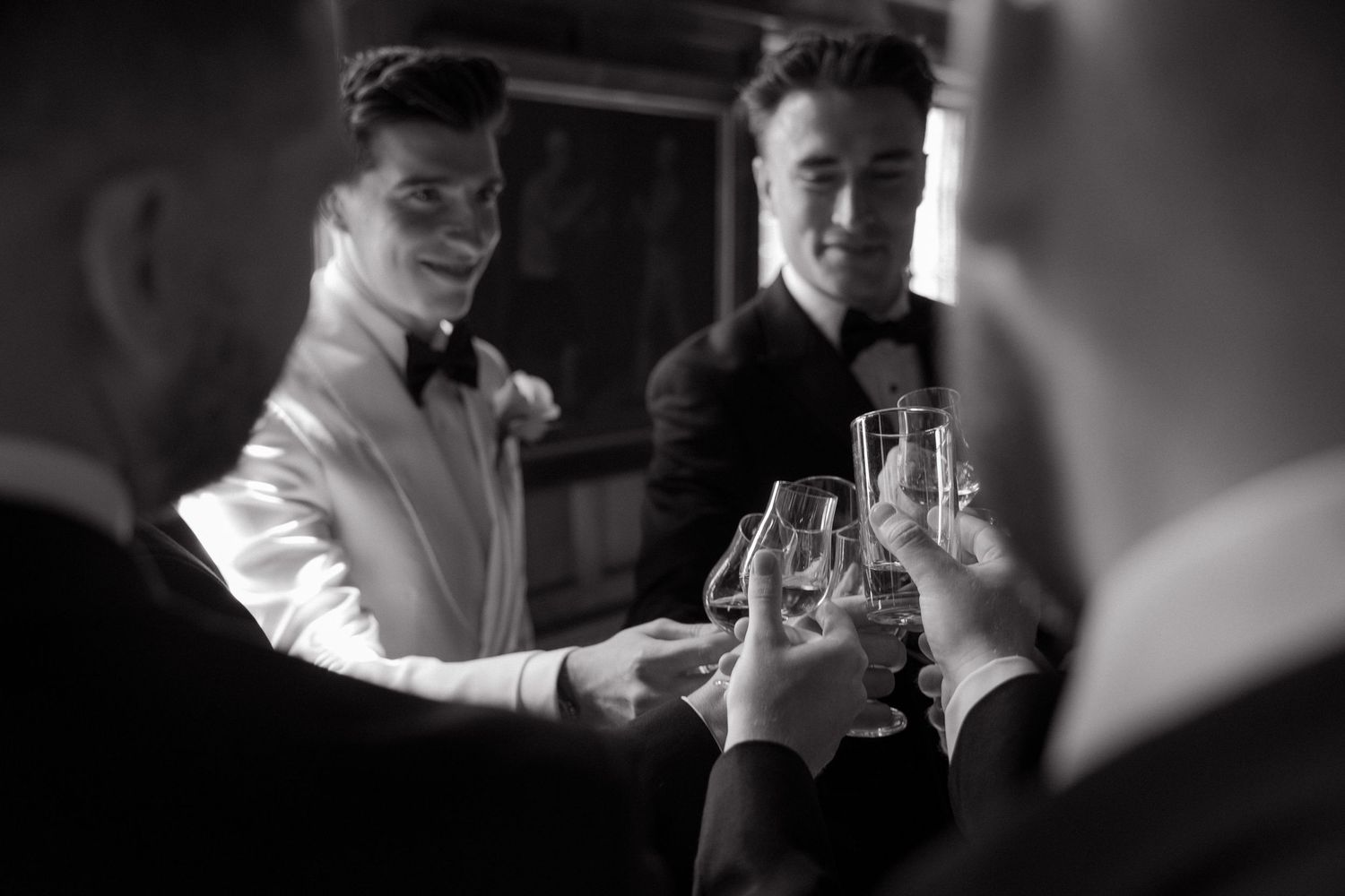 A dramatic black and white montage showing intimate moments at what appears to be a wedding reception or celebration.