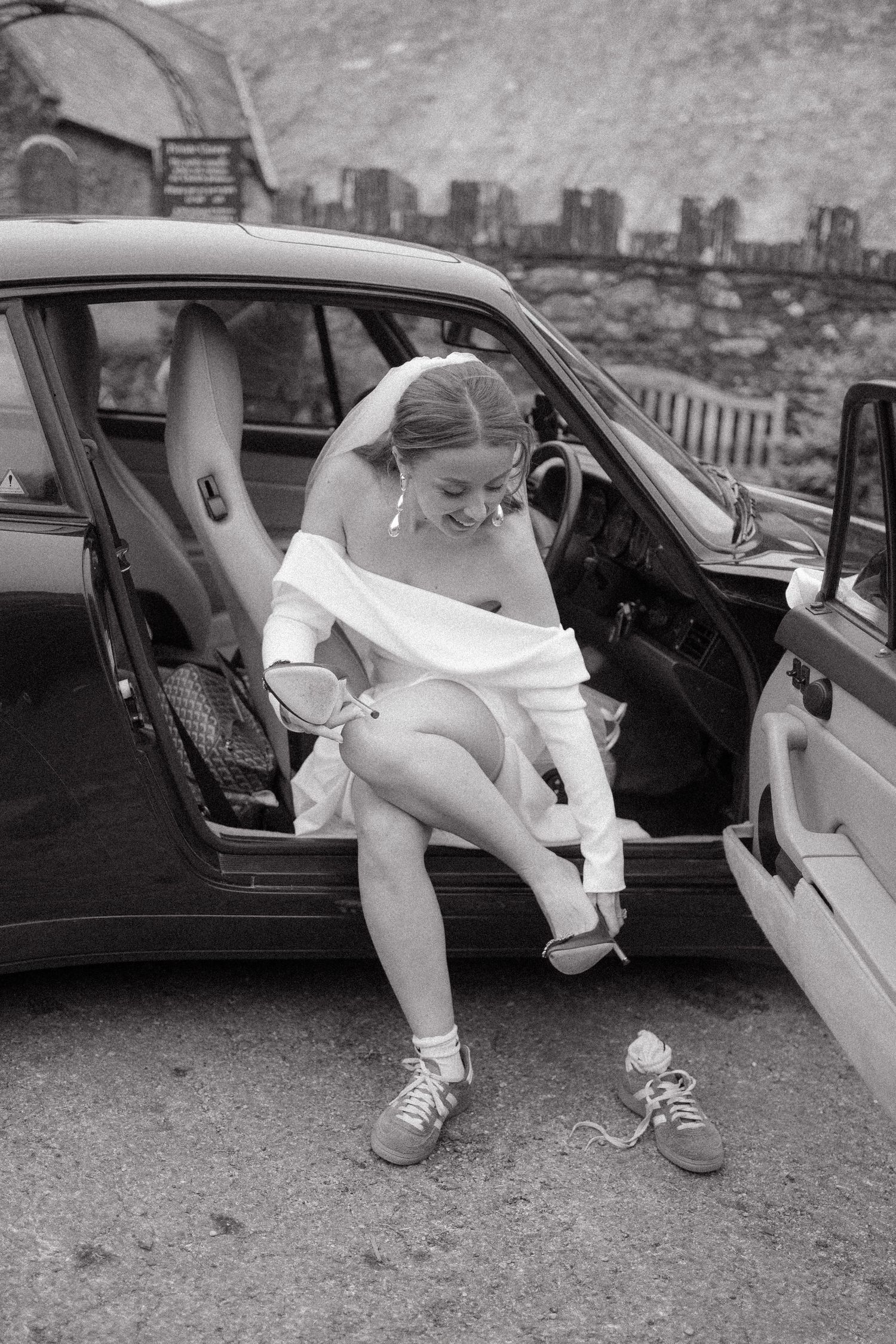 A series of black and white photos showing legs stepping out of car doors in vintage style footwear and clothing.