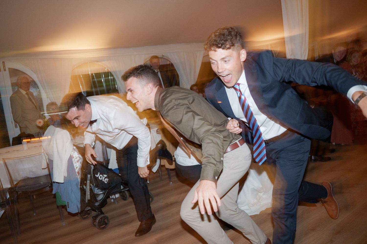 A sequence of dance moves showing someone spinning and falling backwards onto a carpeted floor.