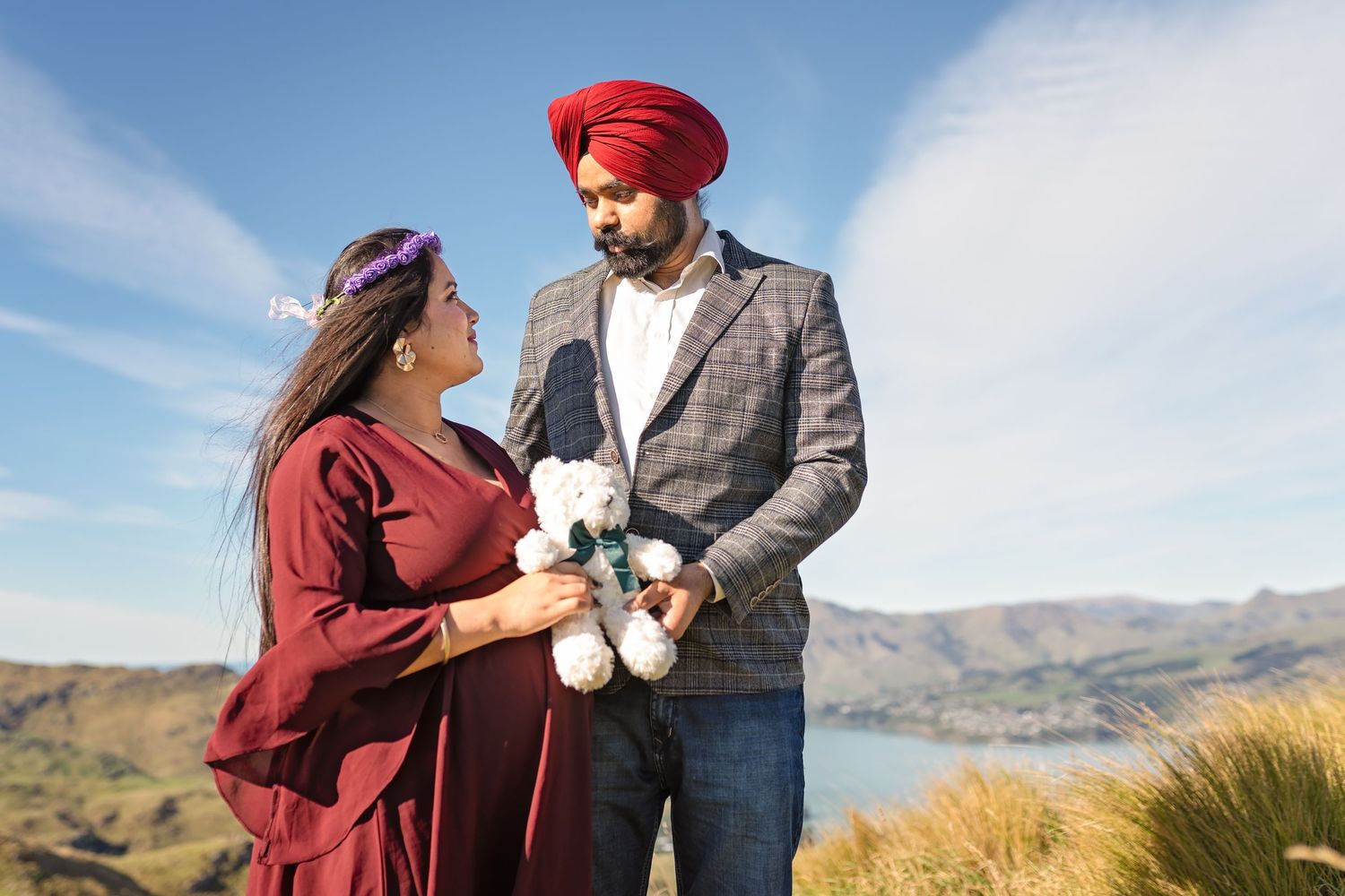 People sharing intimate moments in nature against mountain backdrop with autumnal colors and dramatic landscapes.