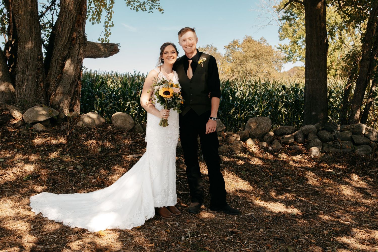 A romantic outdoor wedding photo sequence showing a couple embracing under sunlit trees in a garden setting.