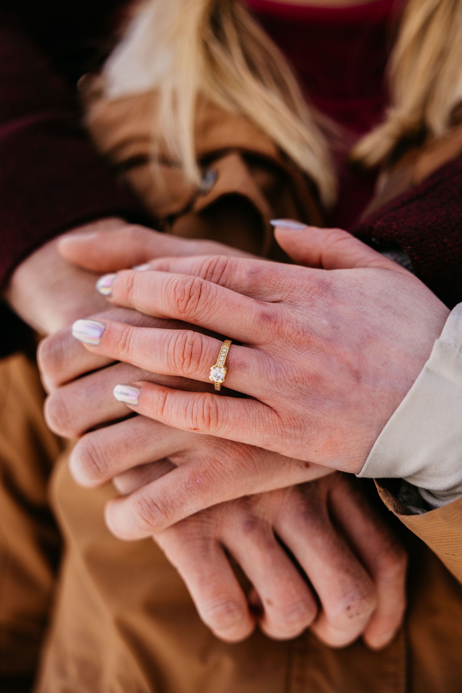 Close-up shots of hands with wedding rings showing the progression of a ring exchange ceremony.