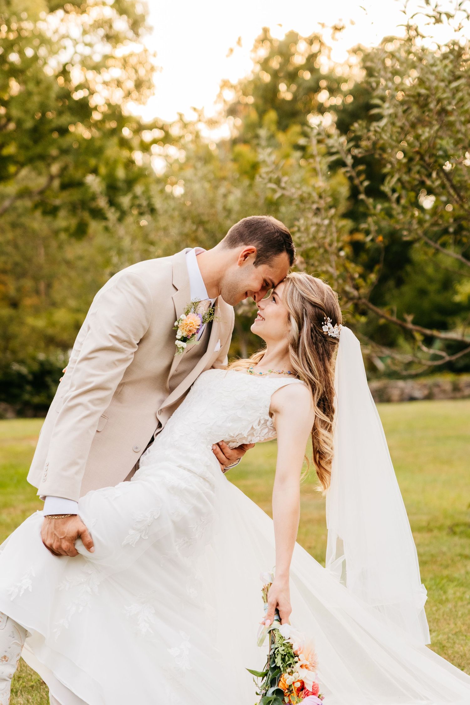 A romantic outdoor wedding photoshoot sequence showing a couple dancing and embracing in a sunlit garden setting.