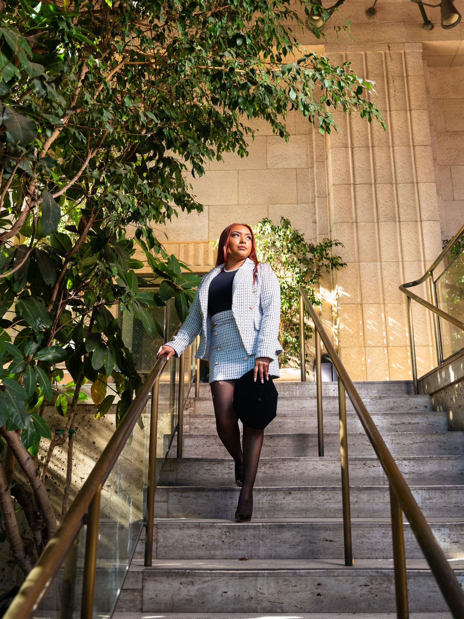 A sequence of five photos shows a person performing a graceful dance move on outdoor stone steps framed by greenery.