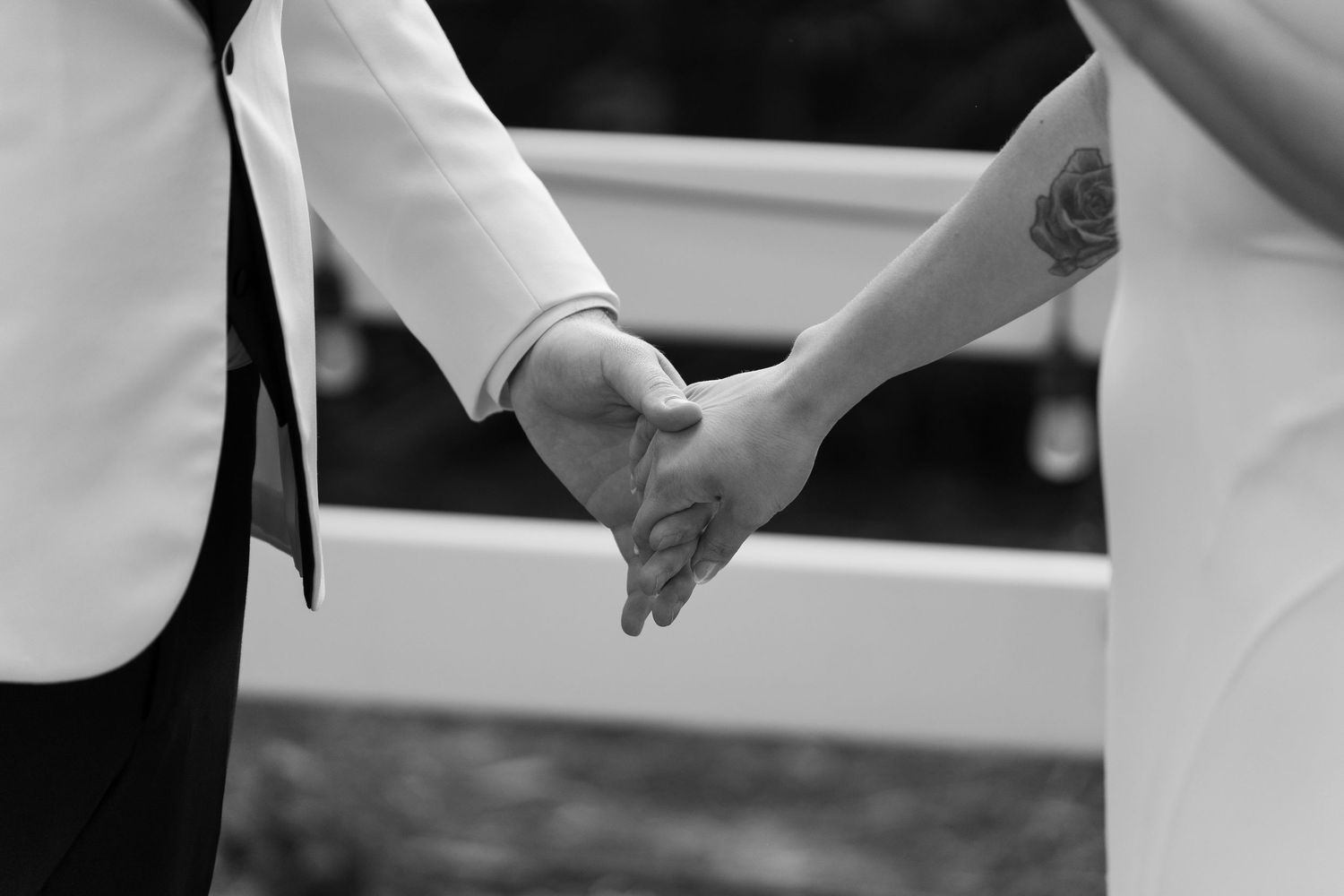 Close-up of wedding couple's hands during ceremony.