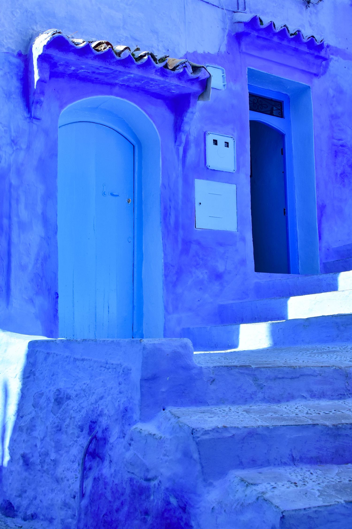 This iconic scene is from Chefchauen, Morocco.  It is also called the Blue City.
