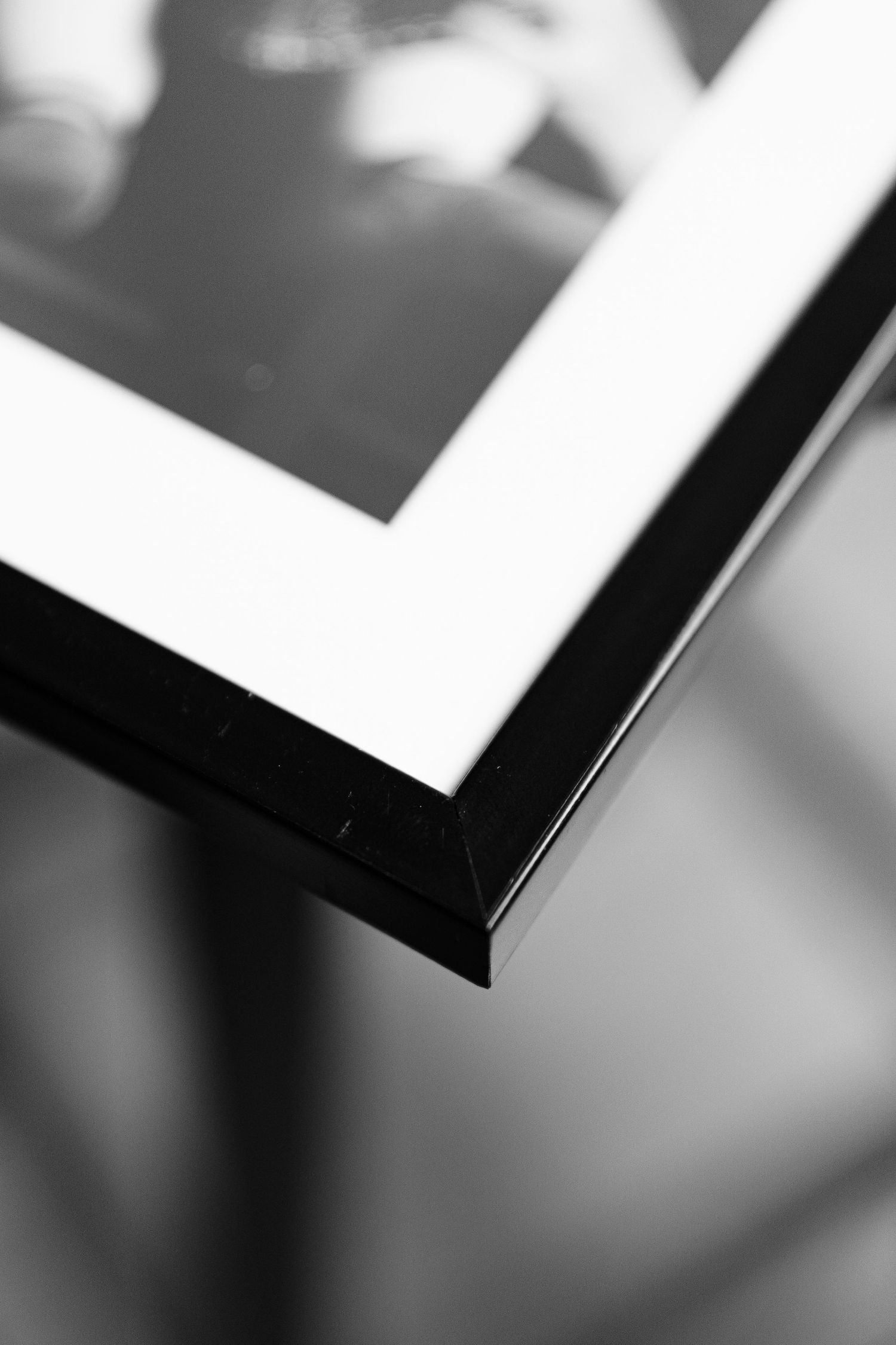 A series of black and white abstract geometric shapes with strong contrast and diagonal lines creating visual depth.
