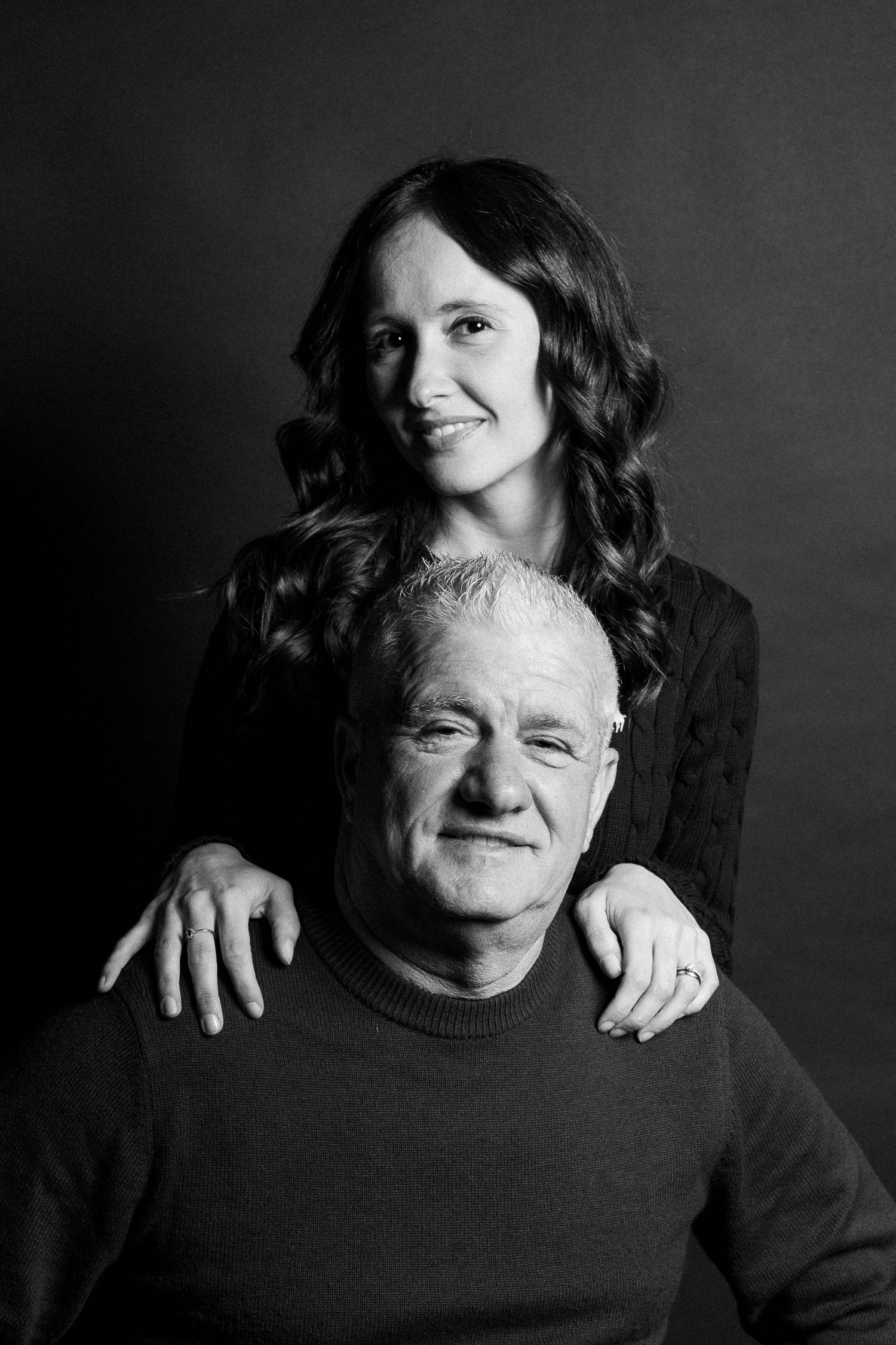 Black and white portrait series capturing tender moments between two people.