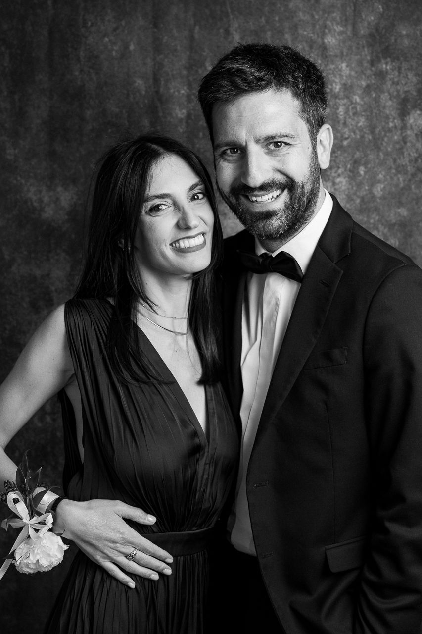 Elegant black and white couple portrait series showing joyful moments together.