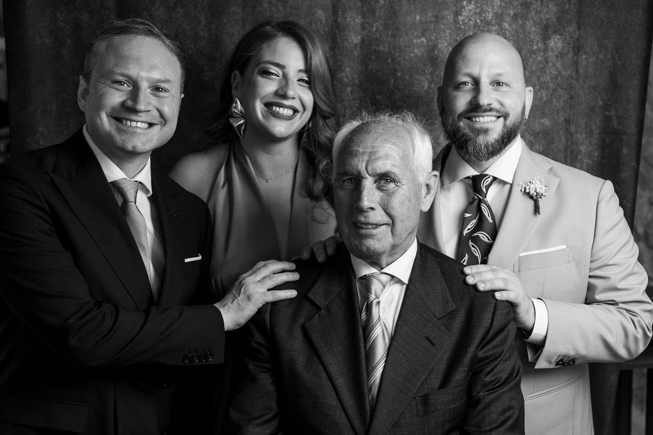 Black and white group portrait series showing multiple people in formal attire.