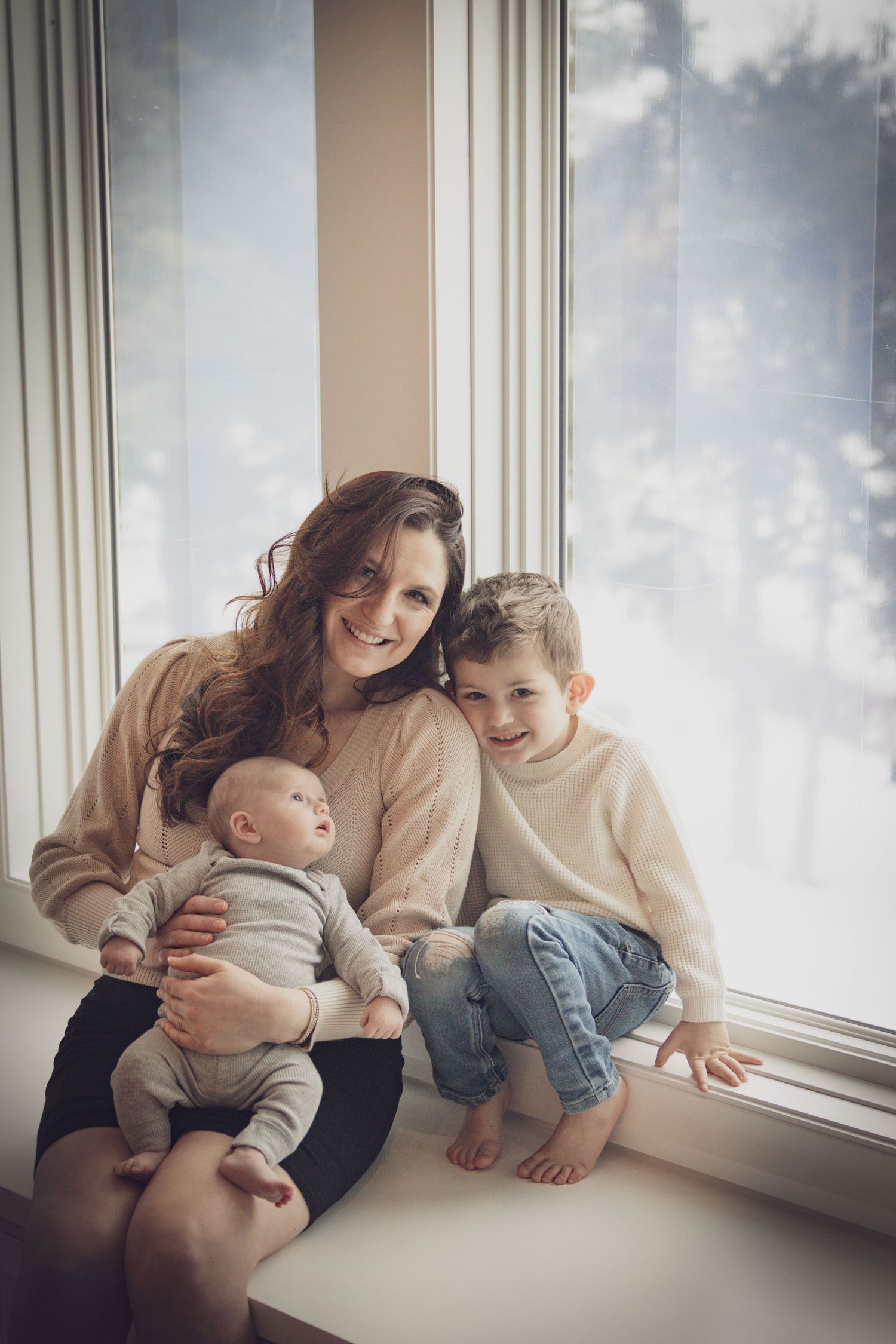 Mom and her kids posing for a photo in their home in Andover
