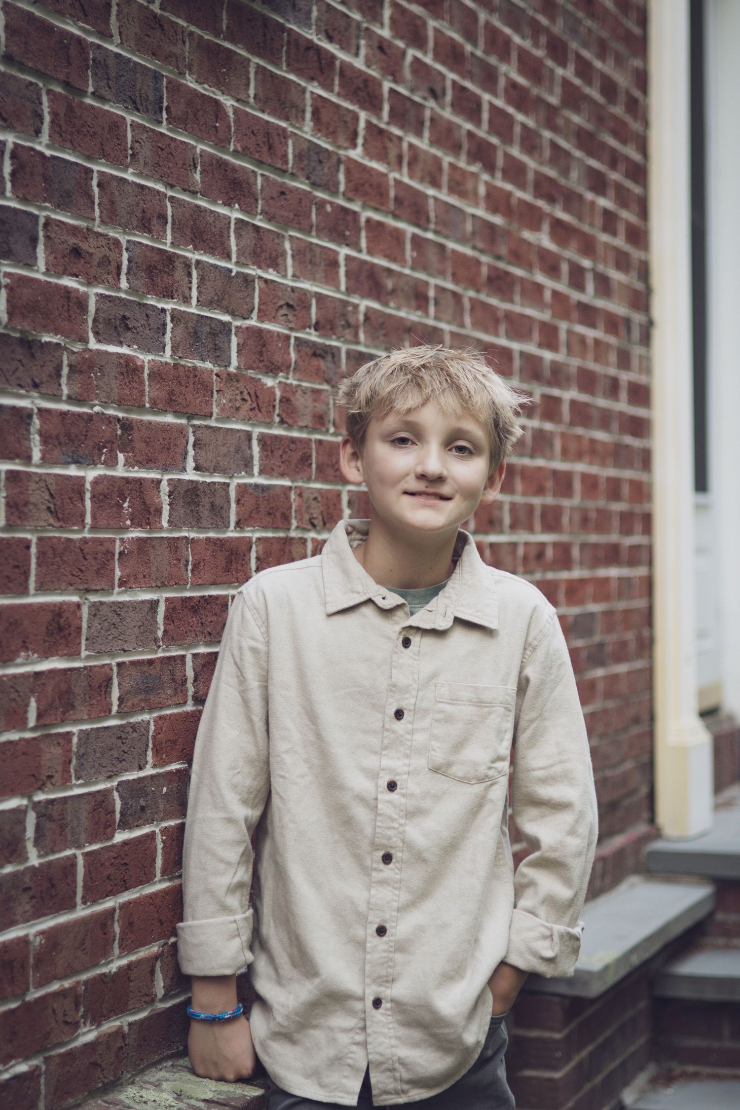 Andover children’s photographer capturing a natural outdoor portrait of a child surrounded by soft, warm light.