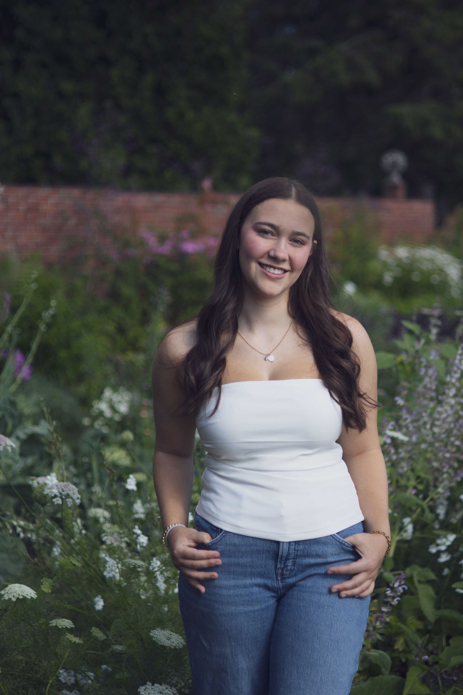 High school senior smiling during outdoor portrait session in Andover, MA