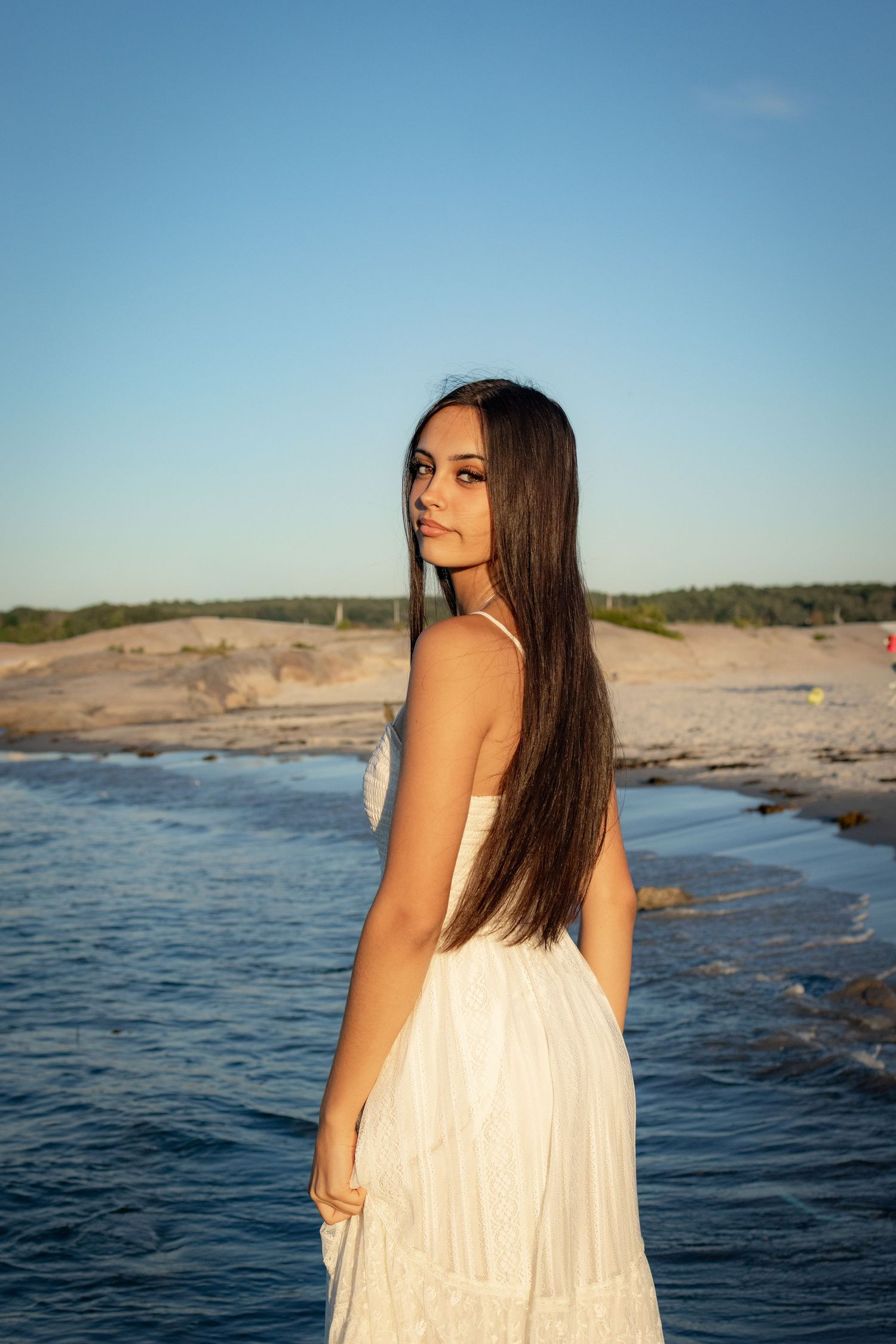 Senior posing at the beach in Gloucester.