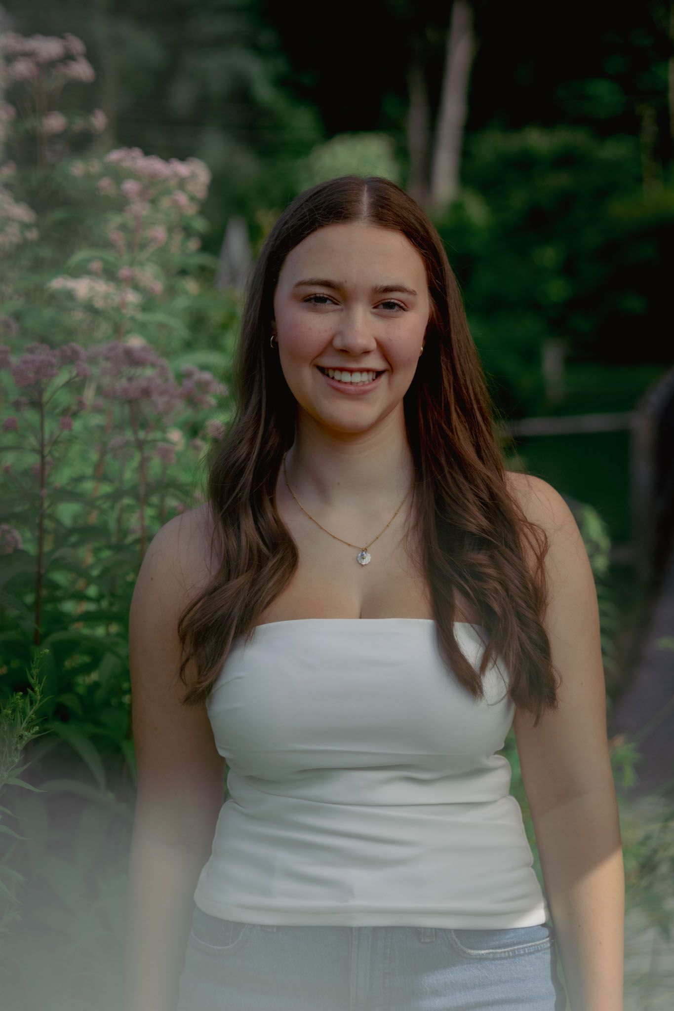 High school senior smiling during outdoor portrait session in Andover, MA