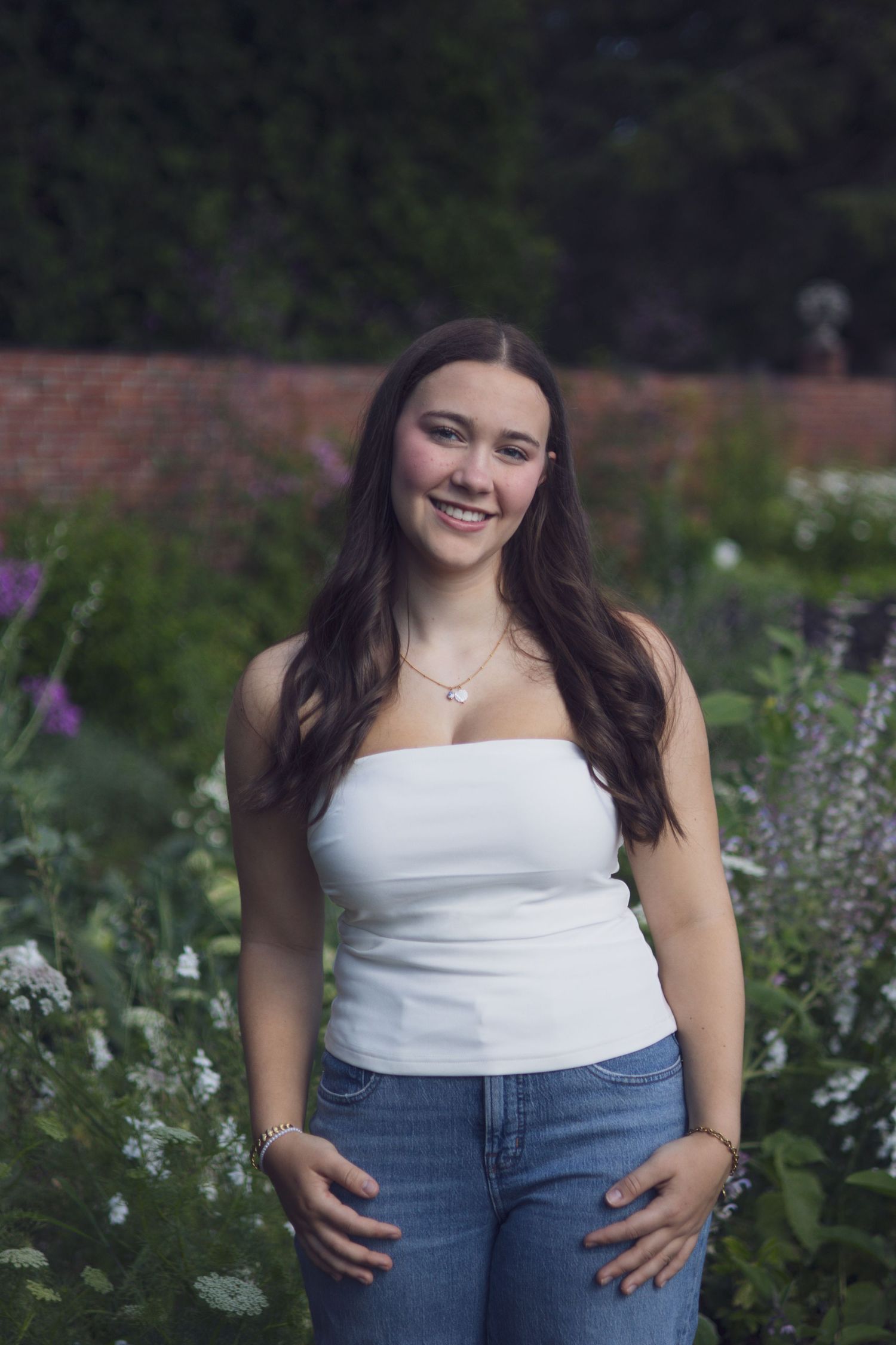High school senior smiling during outdoor portrait session in Andover, MA
