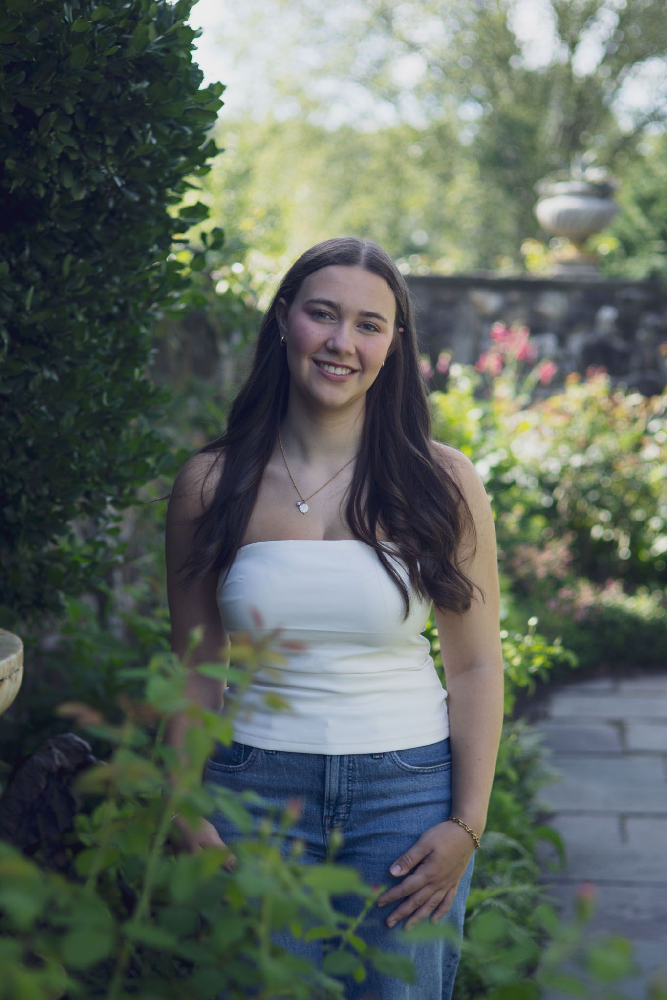 High school senior smiling during outdoor portrait session in Andover, MA