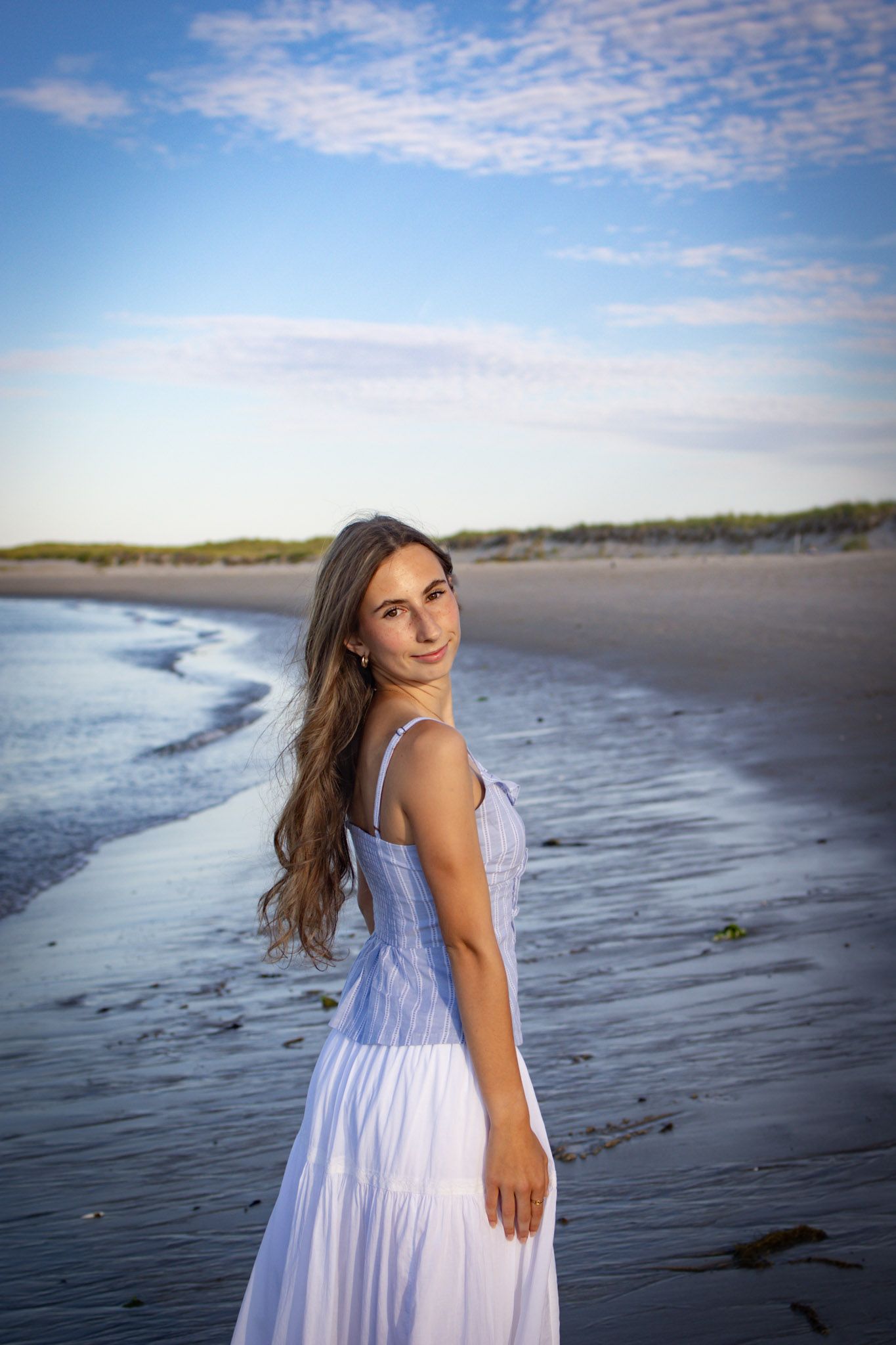 Senior posing at the beach in Ipswich.