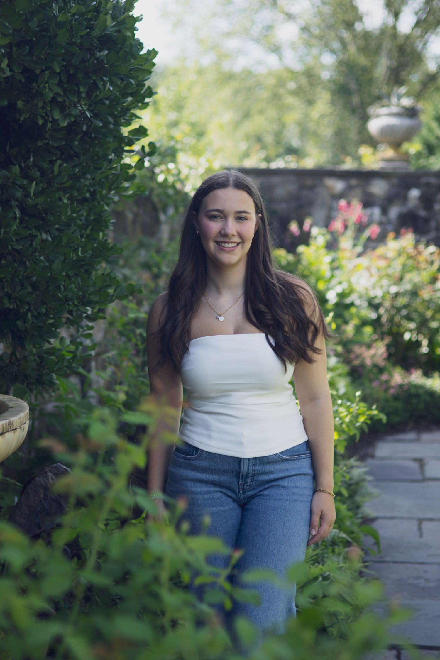 High school senior smiling during outdoor portrait session in Andover, MA