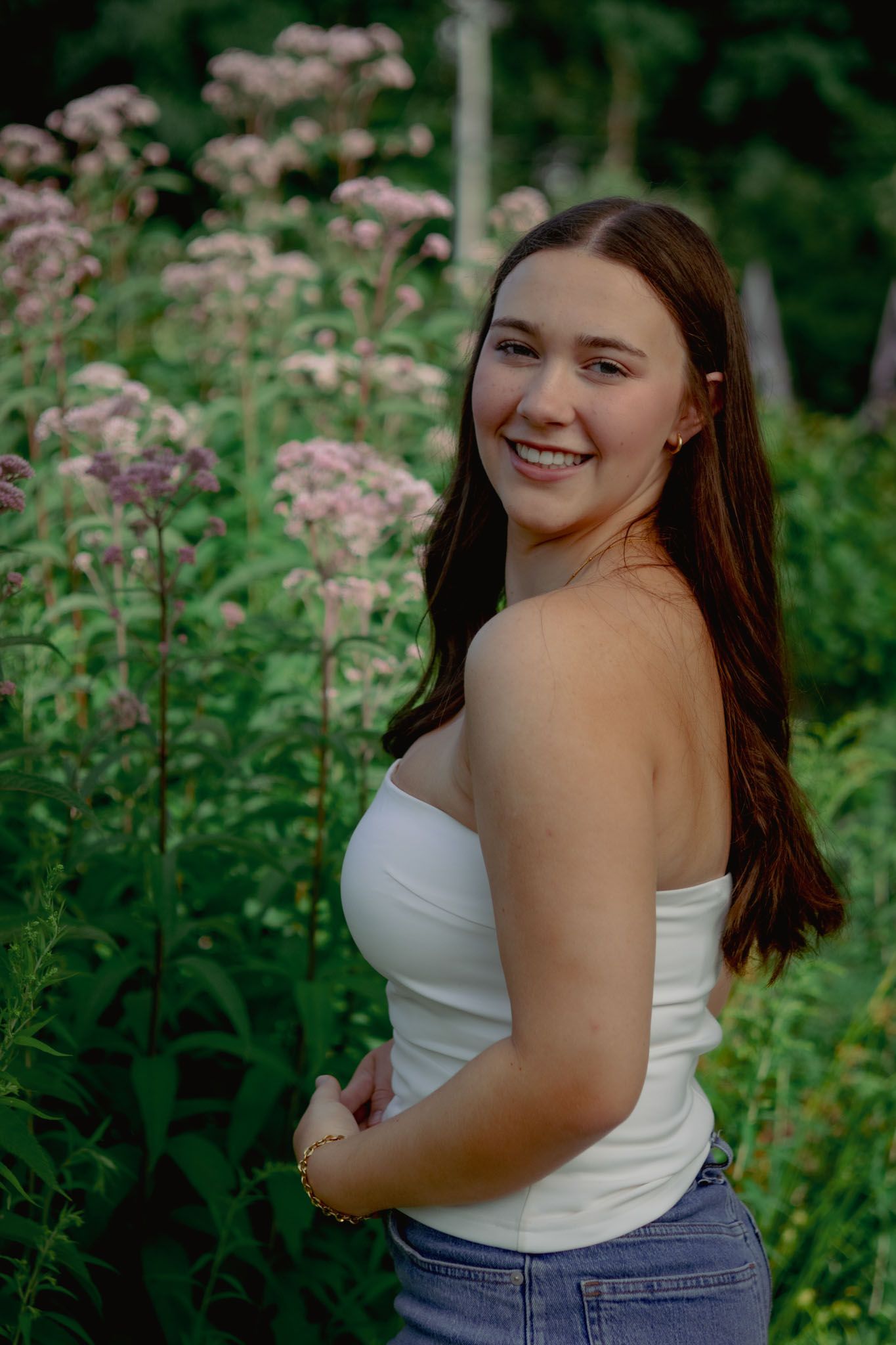 High school senior smiling during outdoor portrait session in Andover, MA