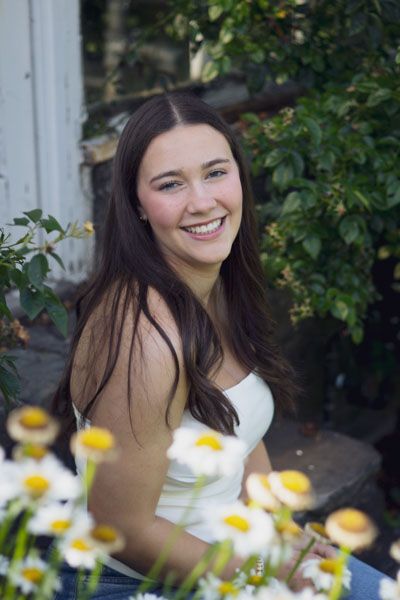 High school senior smiling during outdoor portrait session in Andover, MA