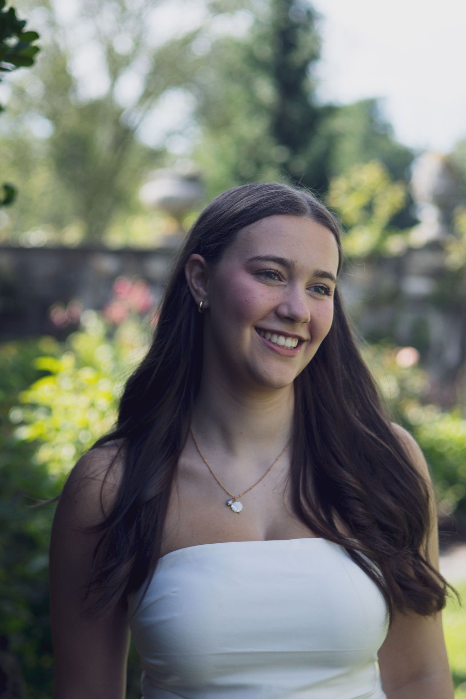 High school senior smiling during outdoor portrait session in Andover, MA