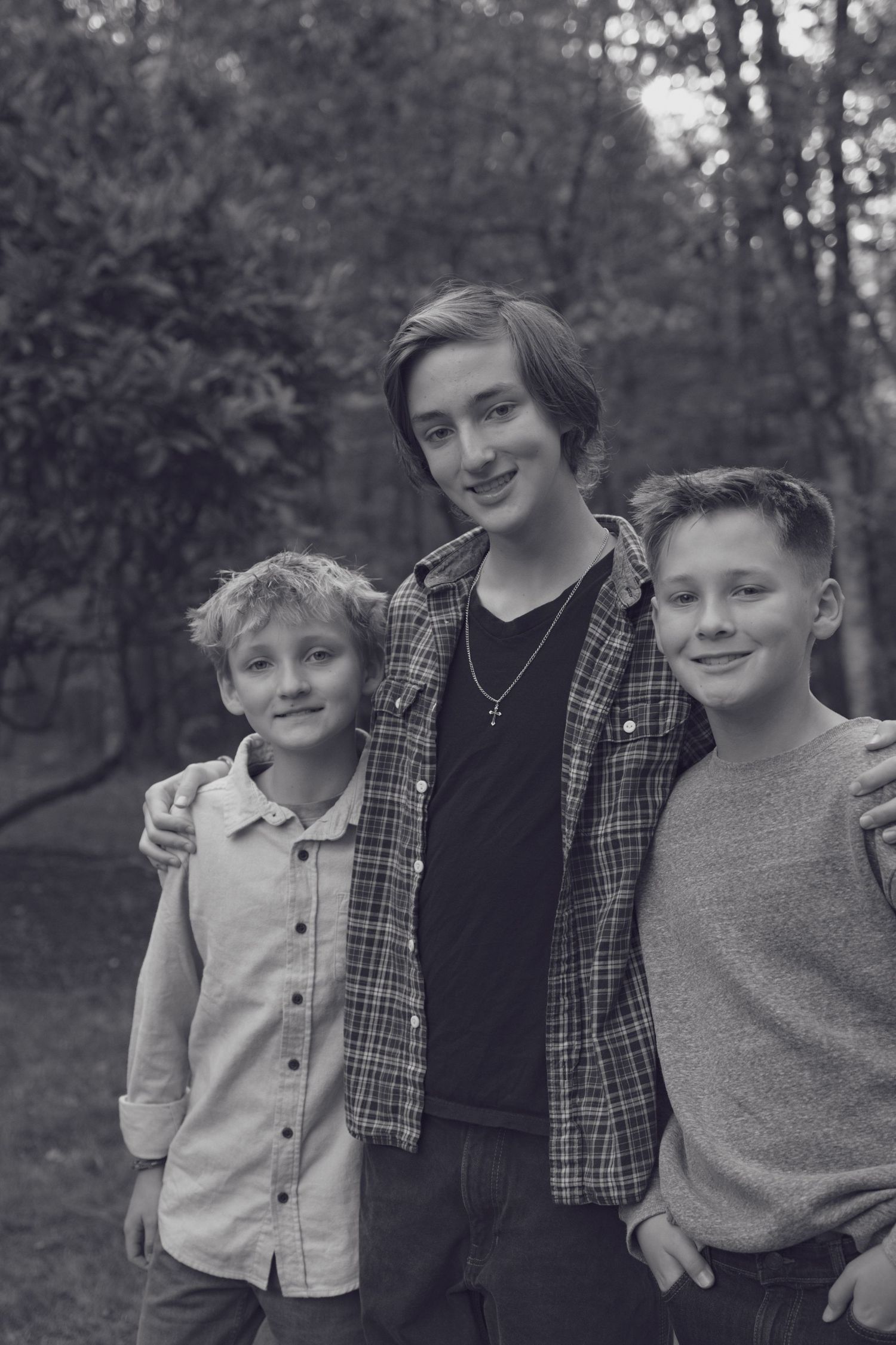 Andover family photographer documenting siblings laughing together during a fall outdoor session in Boxford, MA.