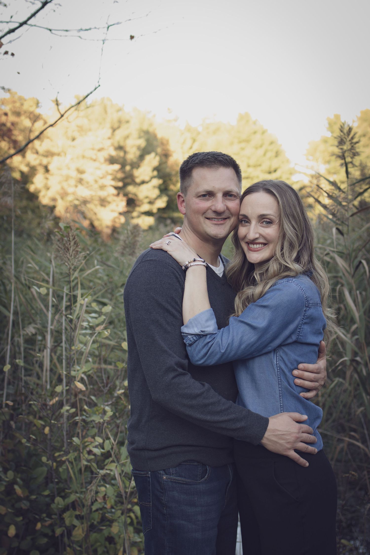 Couple’s portrait during a fall family session in Andover, photographed with soft natural light and autumn colors.