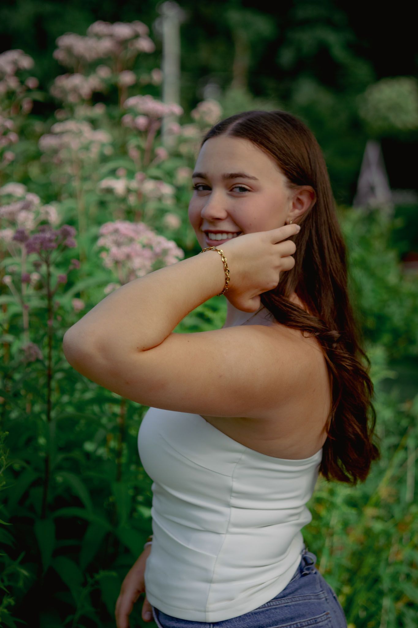 High school senior smiling during outdoor portrait session in Andover, MA