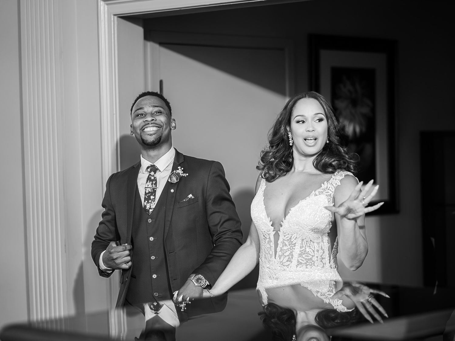 Joyful celebration moment captured in black and white indoors.