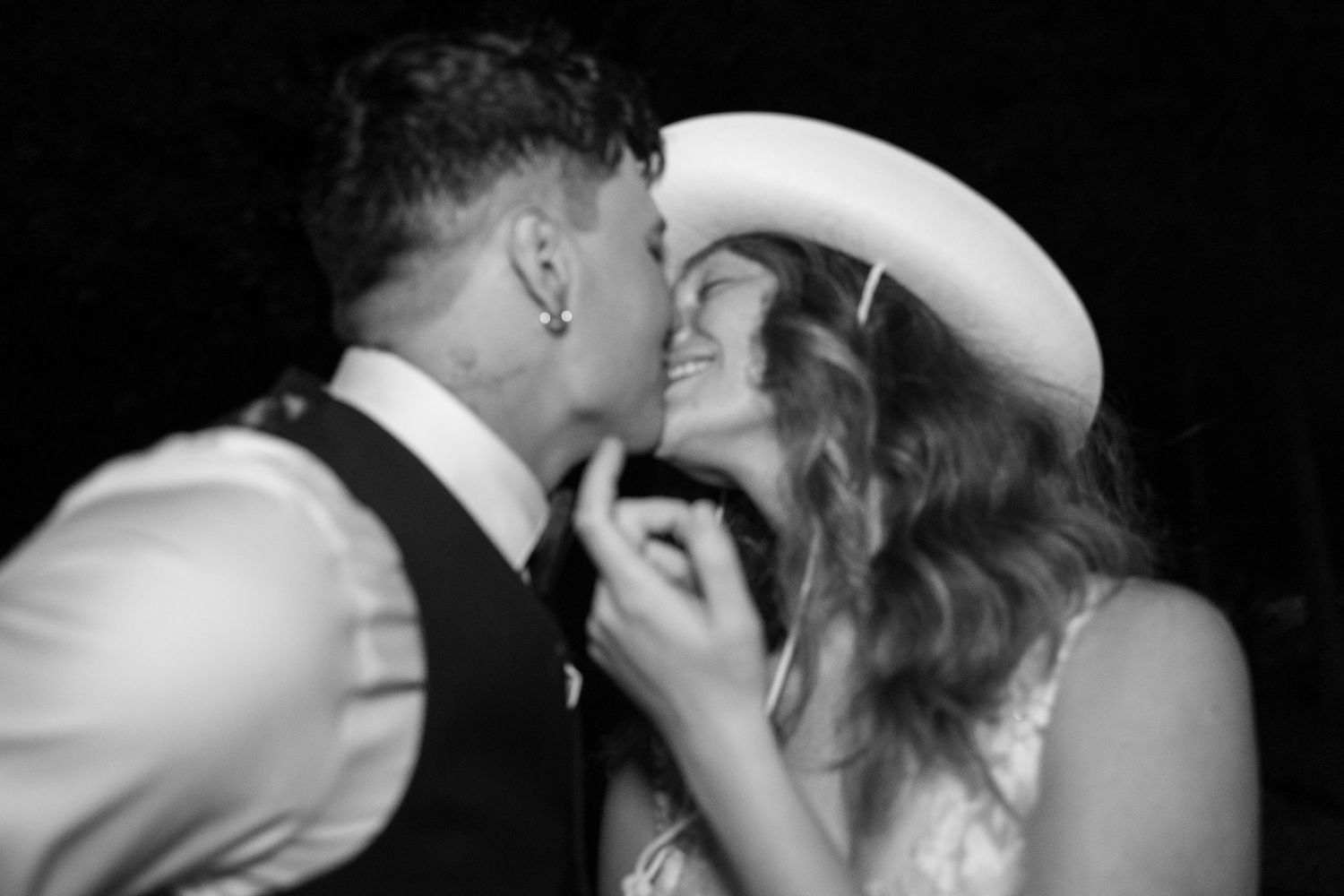 Intimate black and white romantic moment between couple.