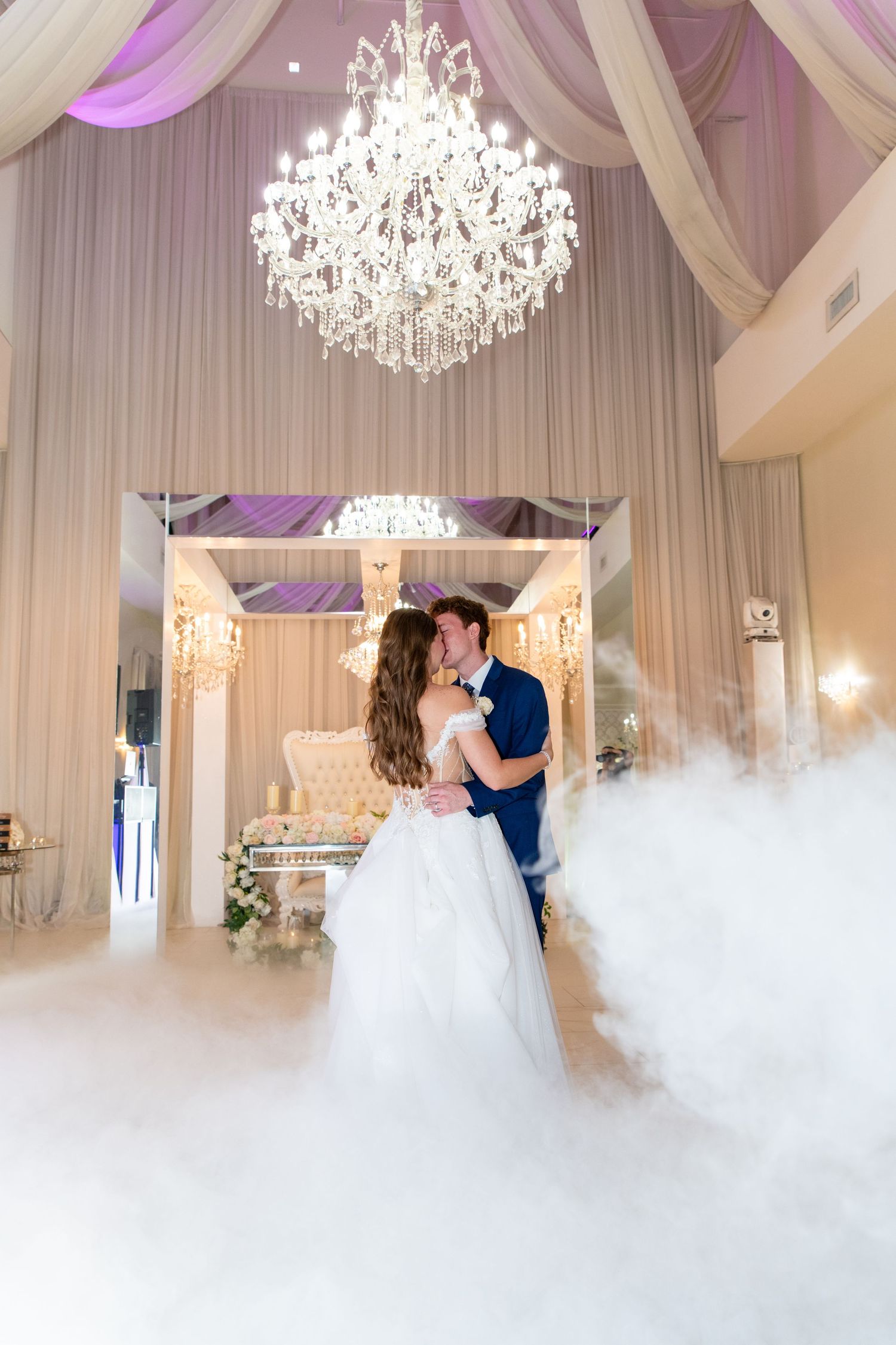 bride and groom sharing first dance at wedding reception