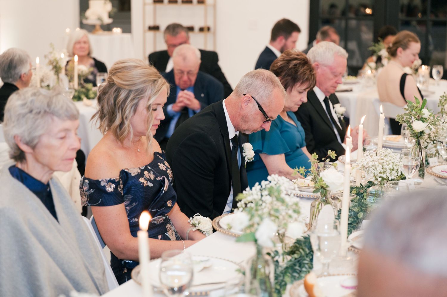 fun wedding reception picture of prayer in McMinnville, Tennessee at The Monroe